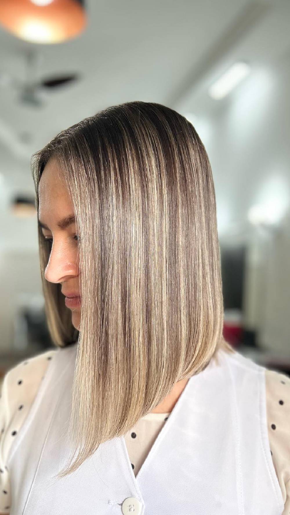 Sleek Medium-Length Blunt Cut with Subtle Highlights
