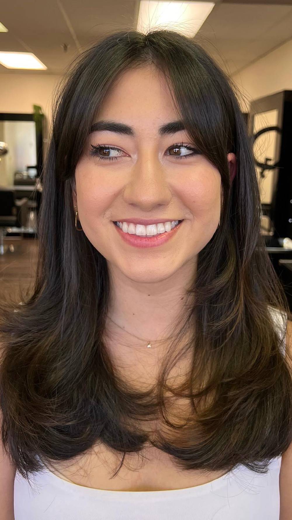 Softly Layered Mid-Length Cut with Face-Framing Bangs