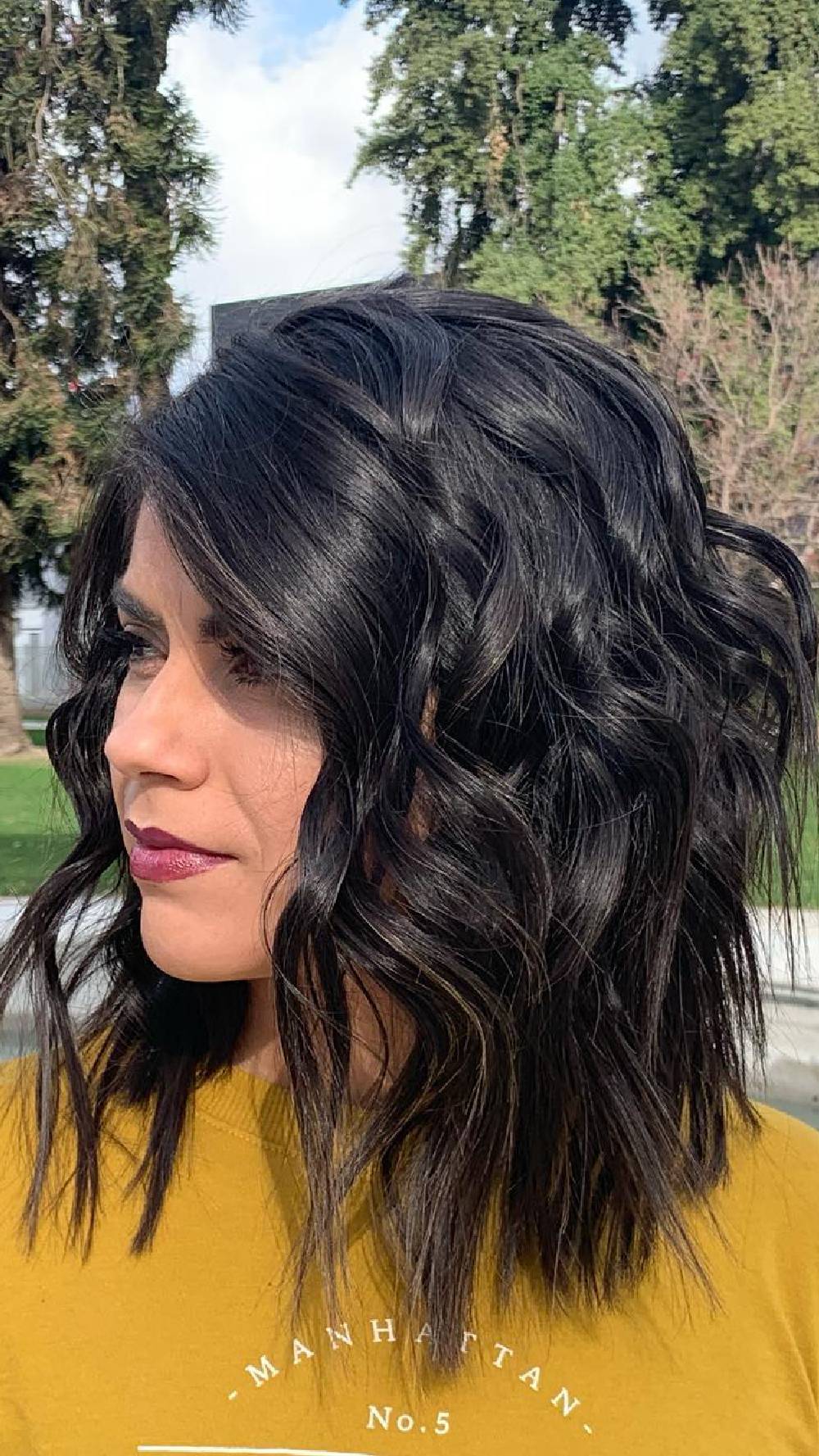 Textured Wavy Mid-Length Cut with Soft Highlights