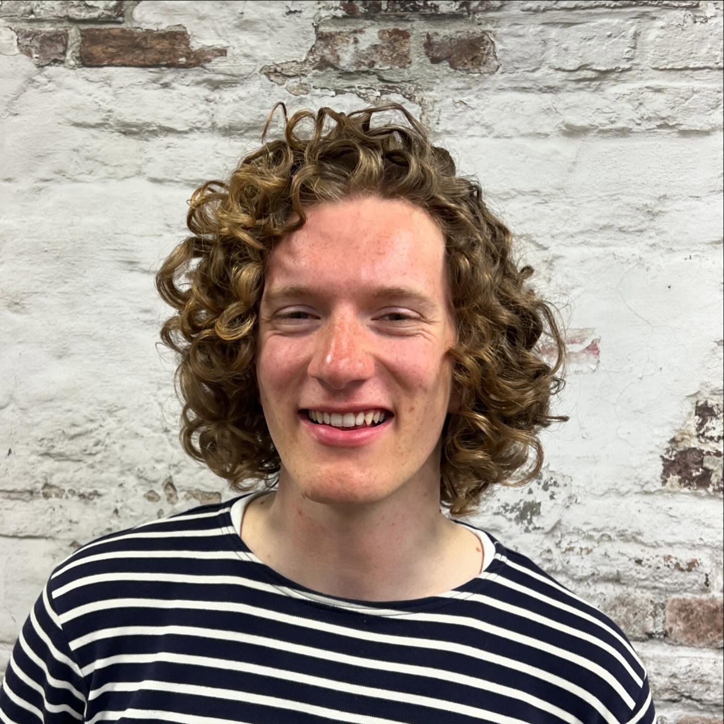 Defined Shoulder-Length Curly Cut with Soft Volume