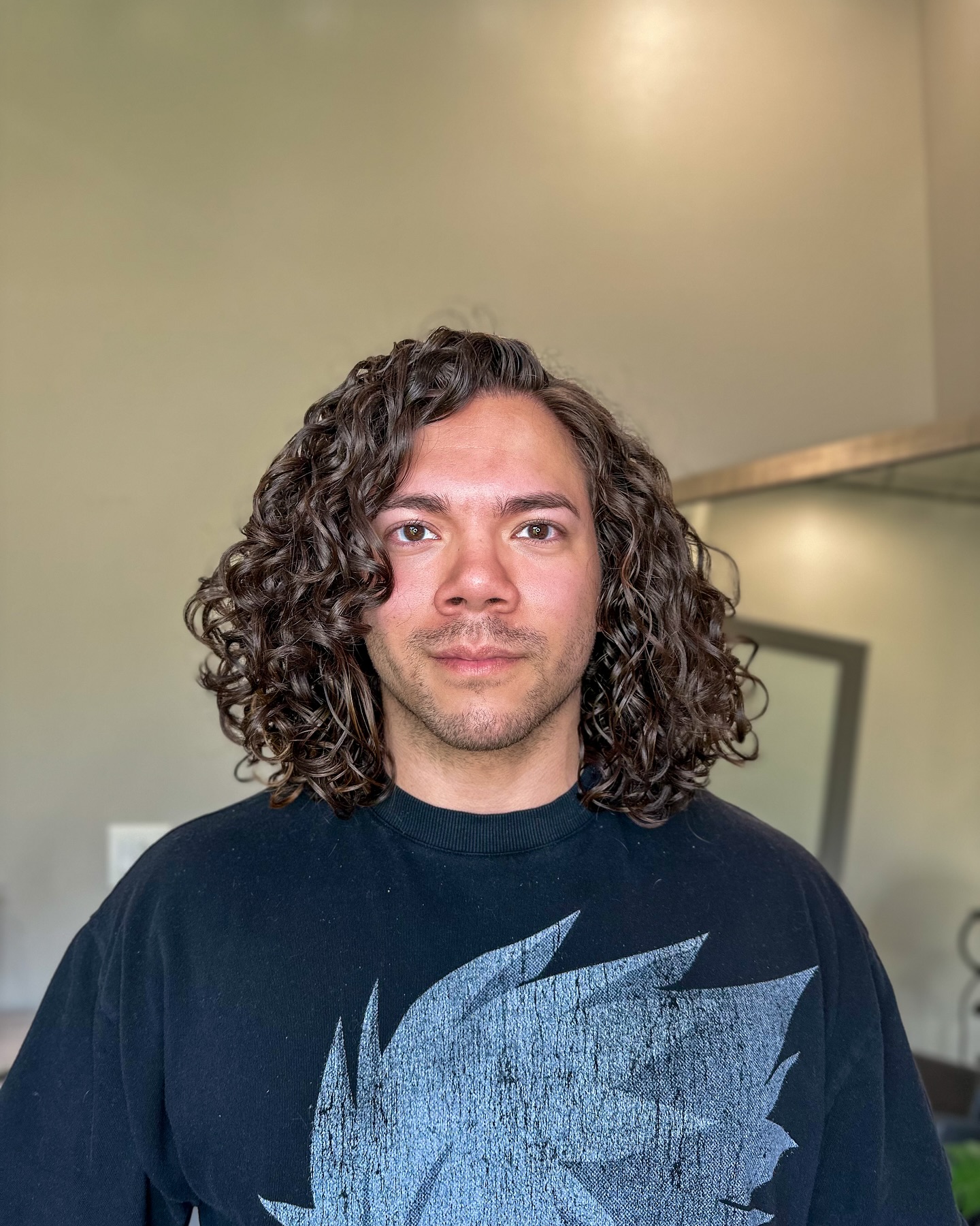Defined Shoulder-Length Curly Cut with Subtle Layers