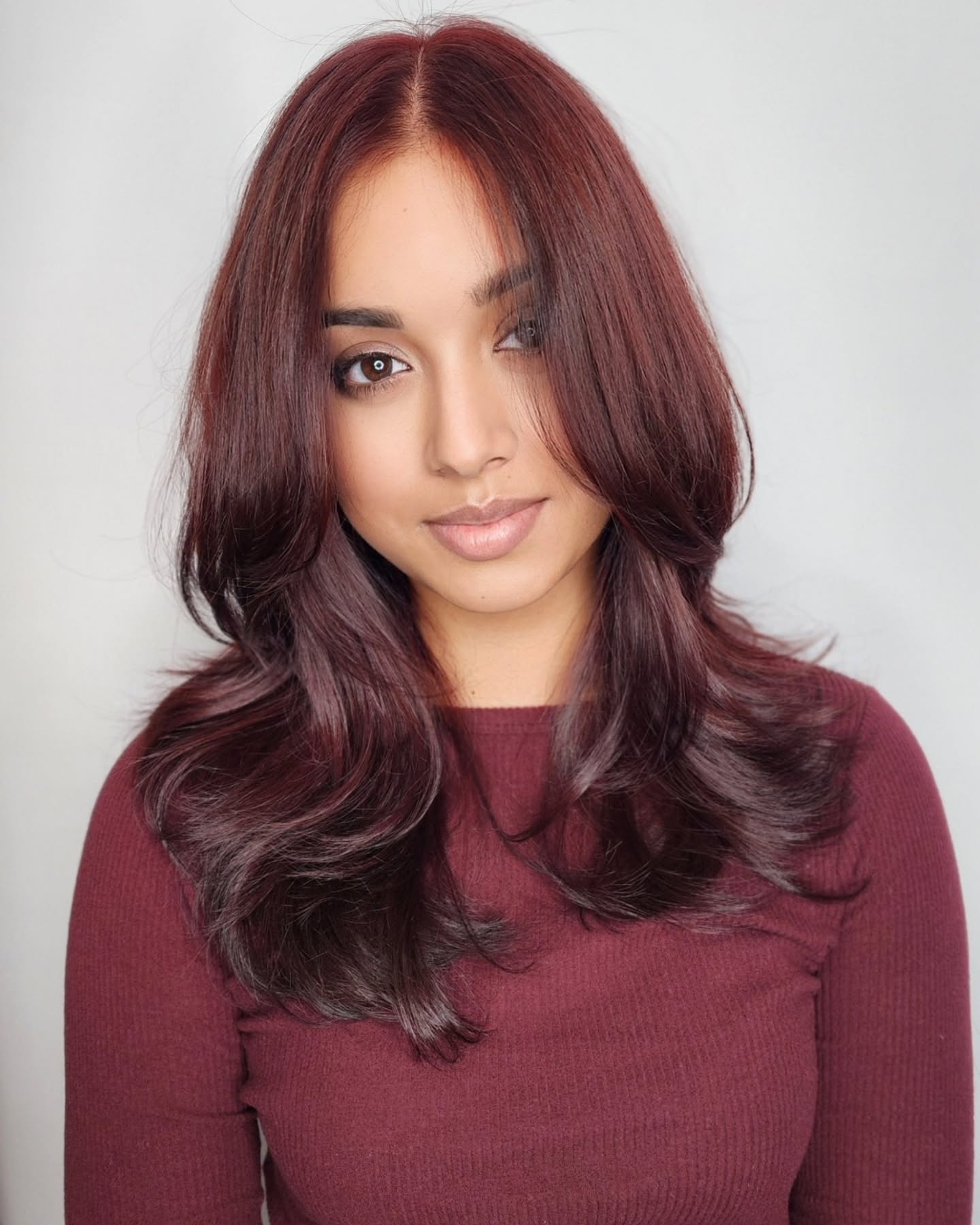 Elegant Black Cherry Balayage with Face-Framing Layers