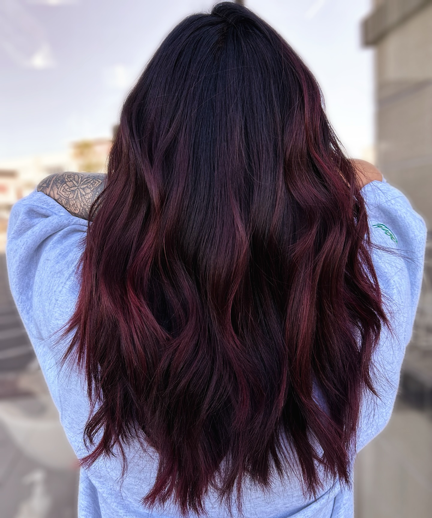 Rich Black Cherry Balayage with Soft Waves