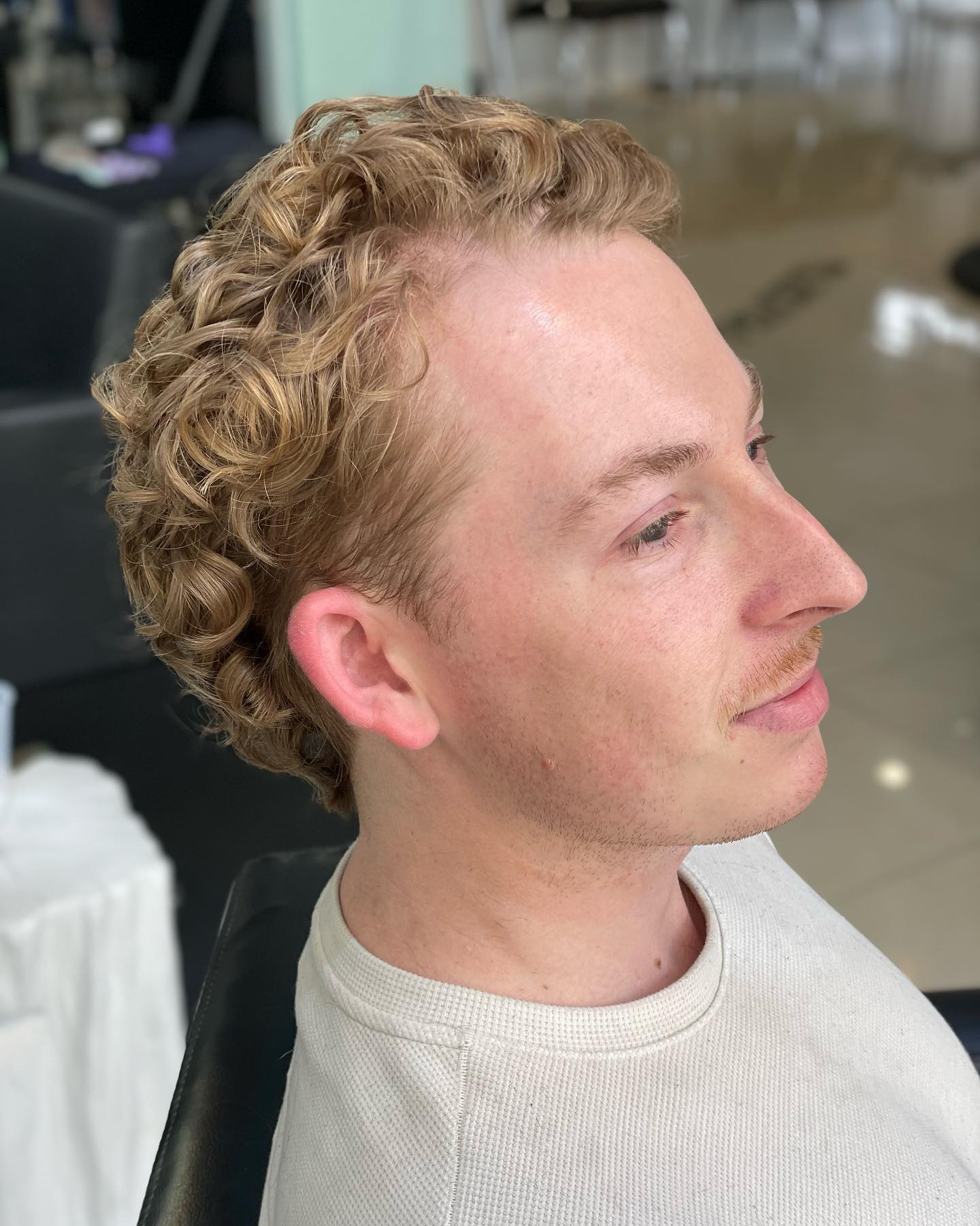 Stylish Defined Curly Cut with Tapered Sides