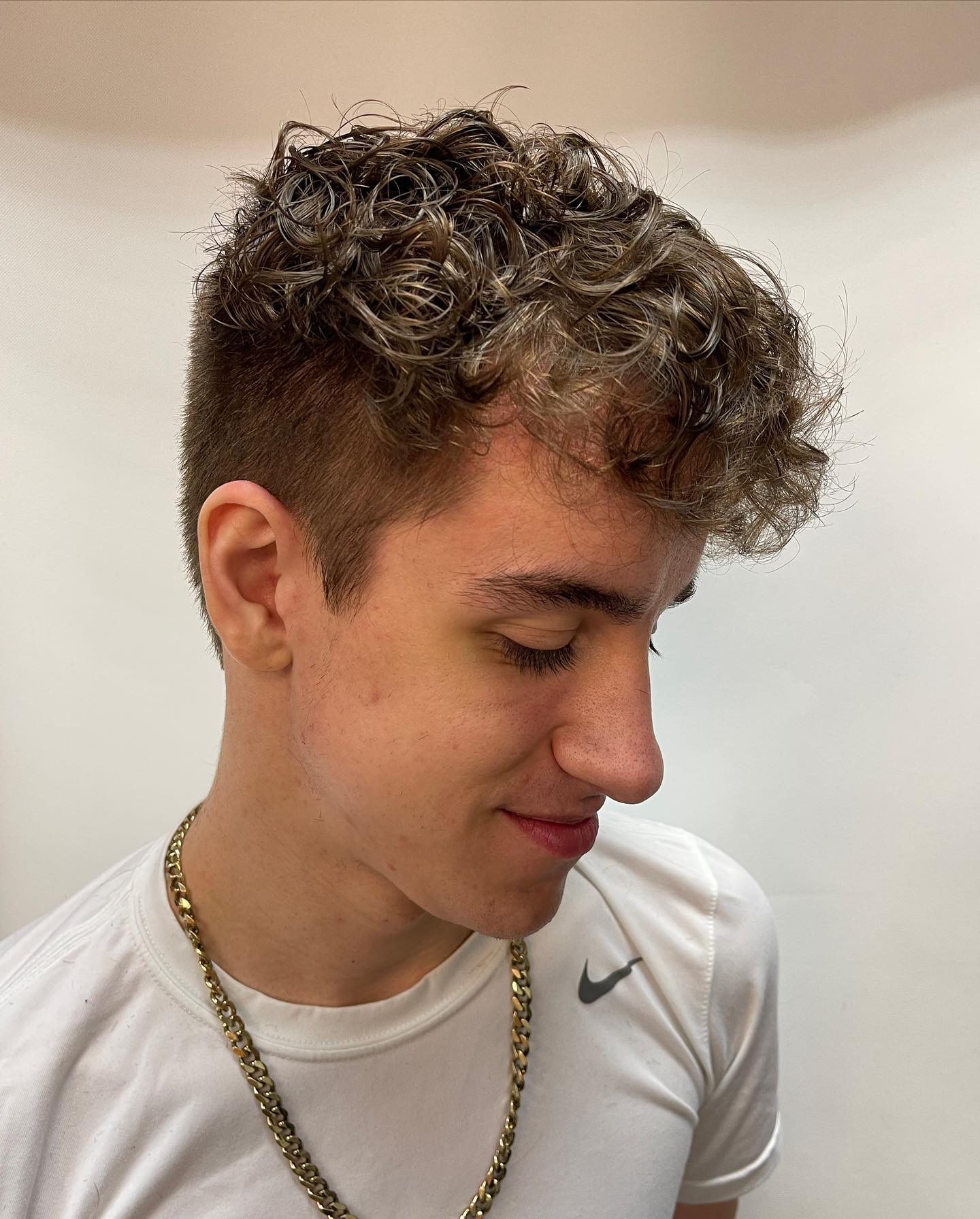 Textured Curly Top with Tapered Sides