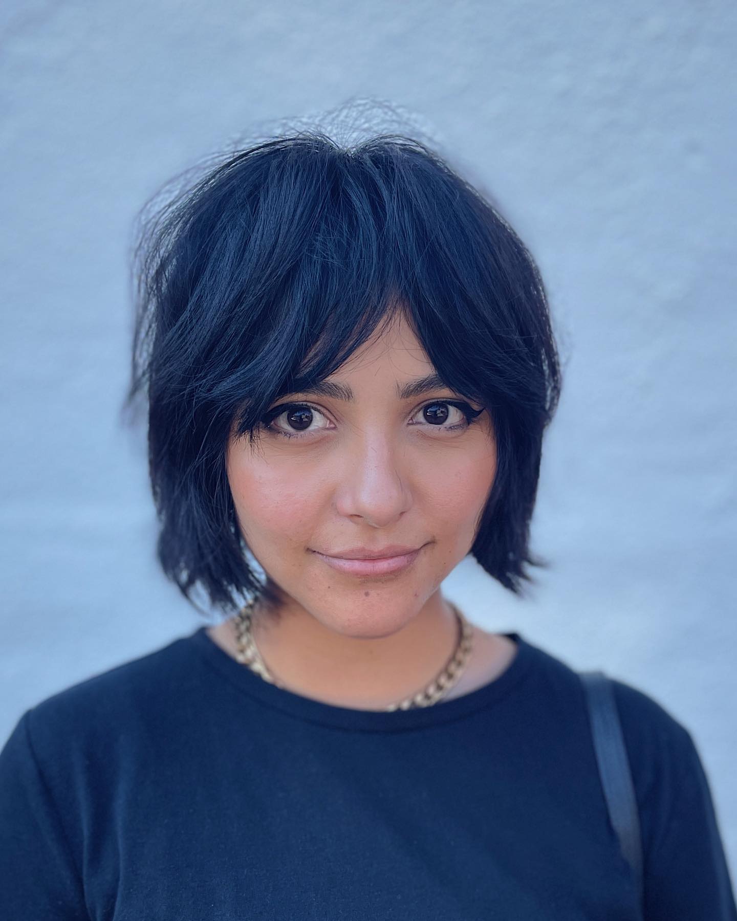 Bold Textured Layered Bob with Wispy Bangs