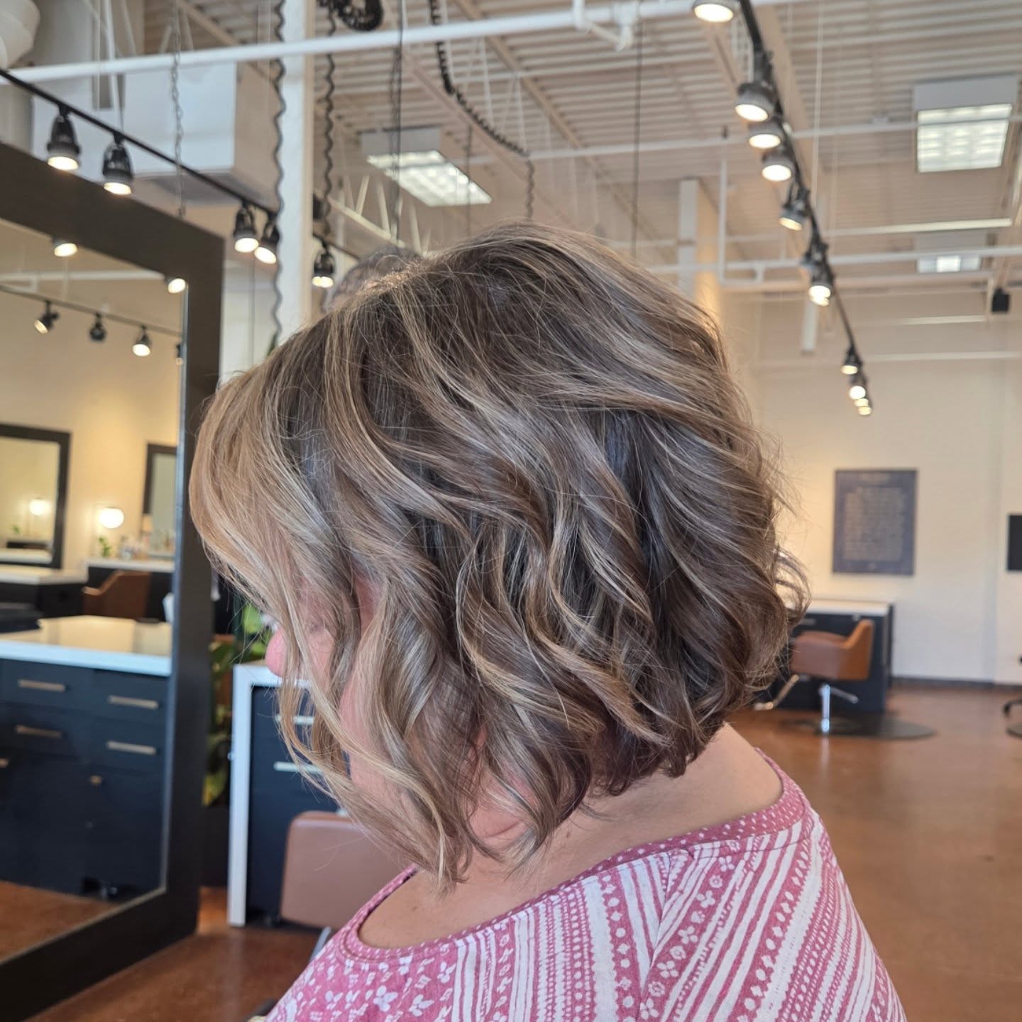 Softly Textured Wavy Bob with Warm Highlights