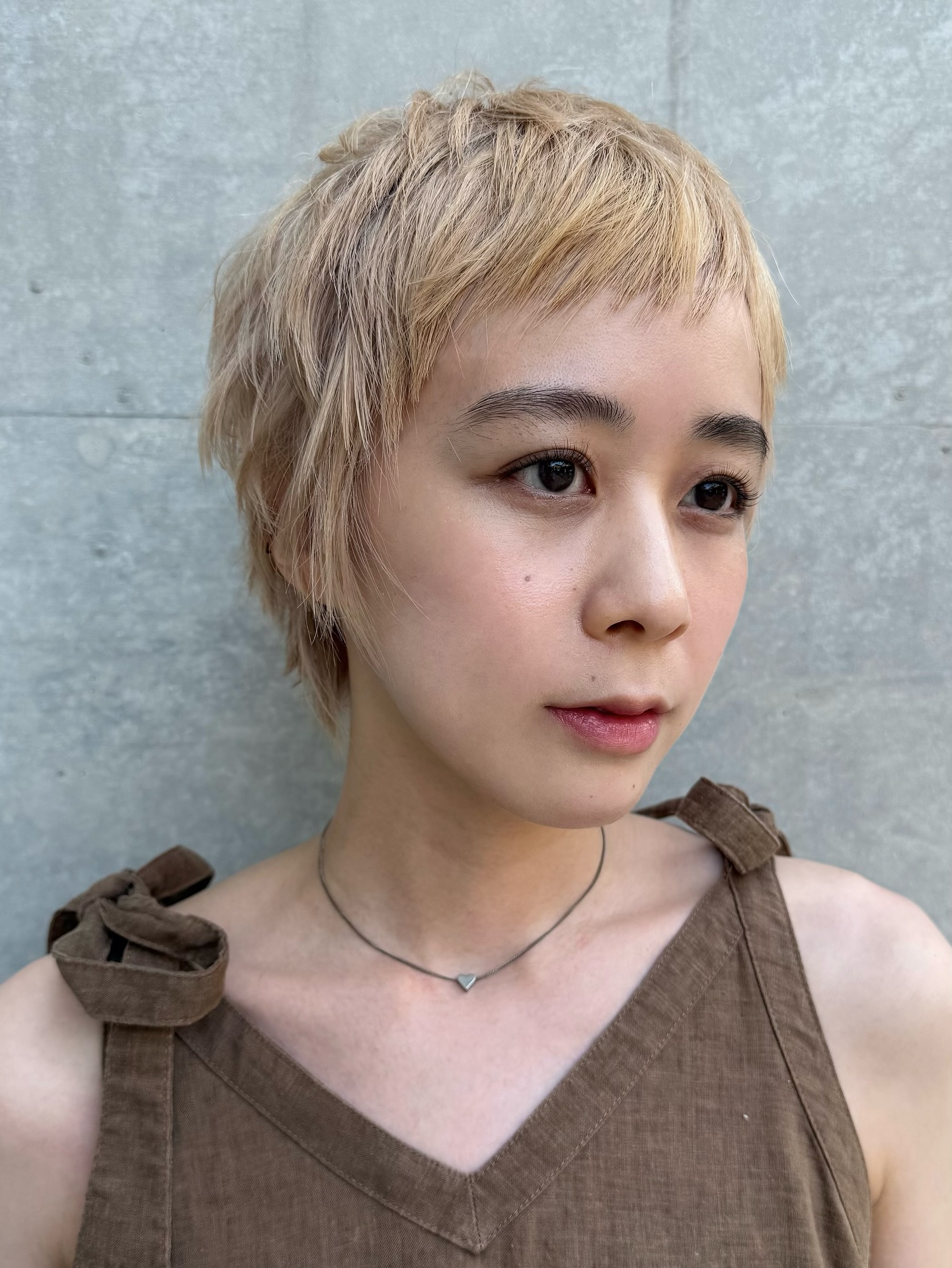 Textured Ash Blonde Pixie with Soft Bangs