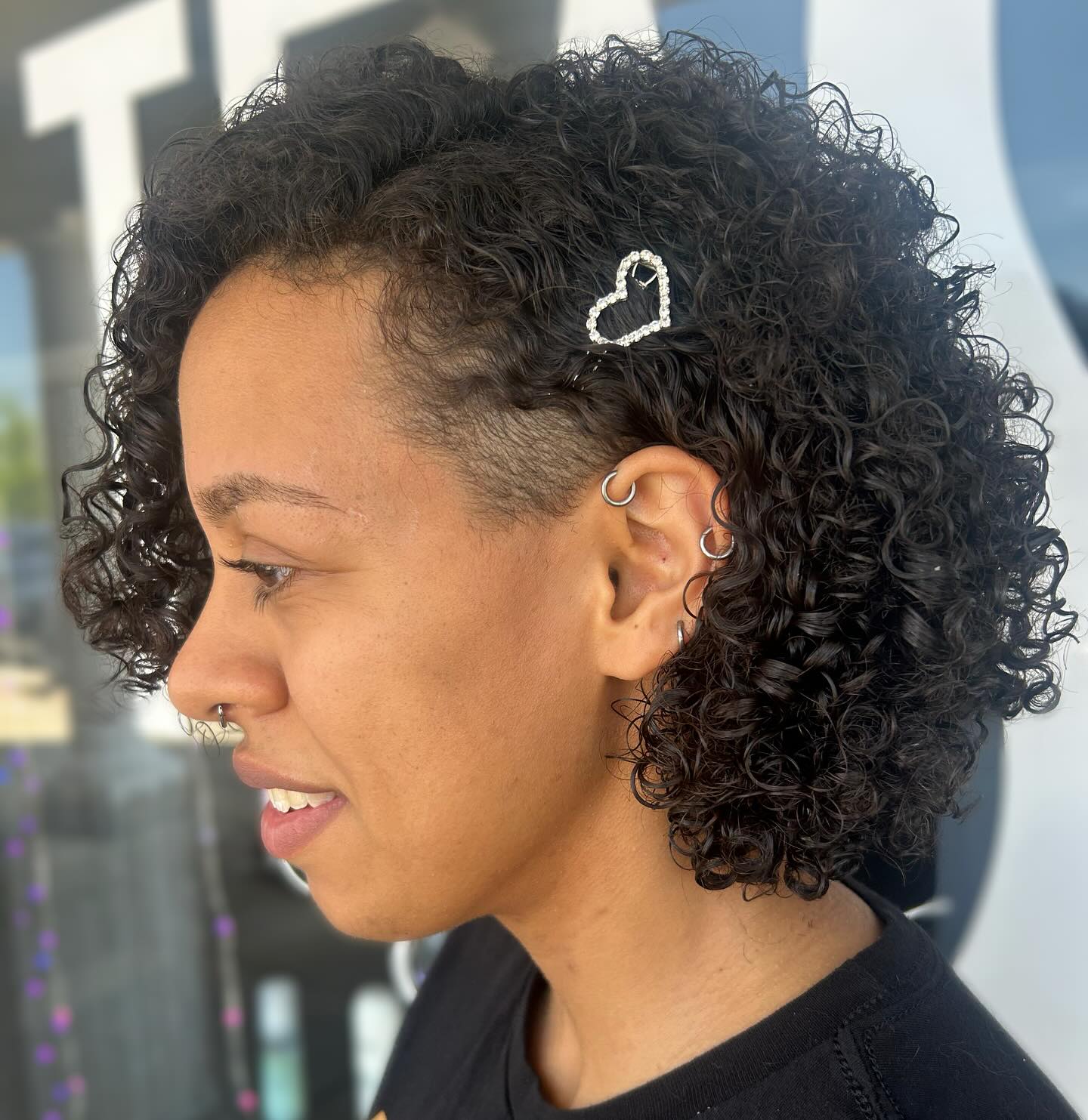 Trendy Short Curly Cut with Undercut Detail