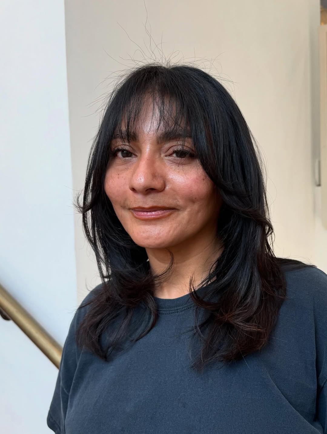 Elegant Layered Cut with Soft Face-Framing Bangs