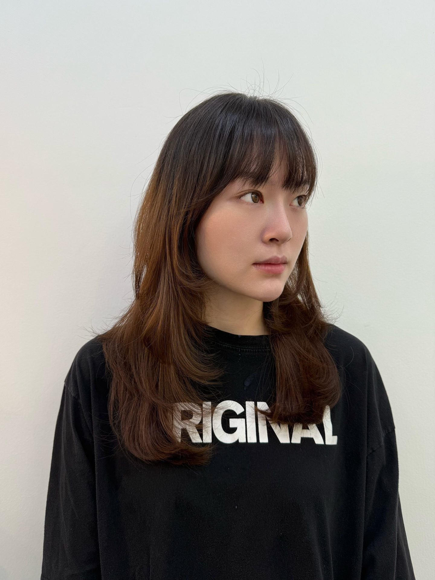 Modern Face-Framing Layers with Soft Bangs