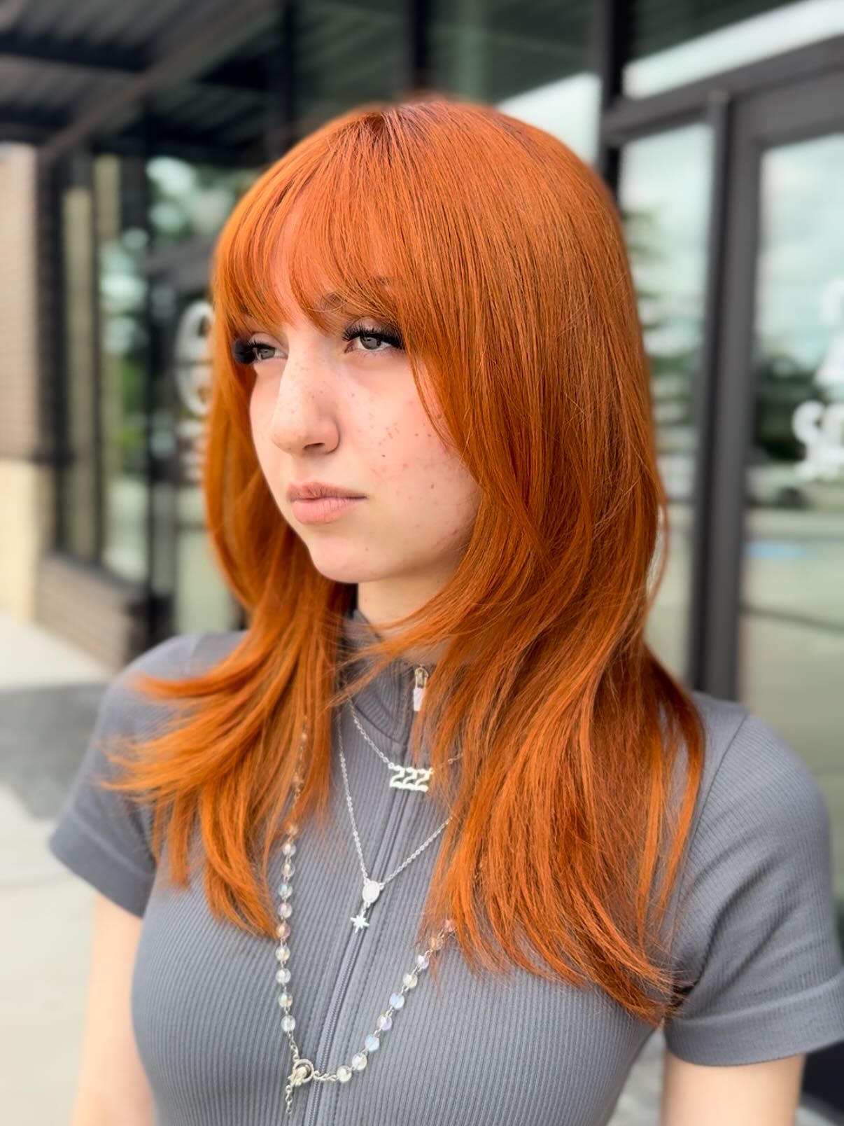 Radiant Copper Long Layers with Blunt Bangs