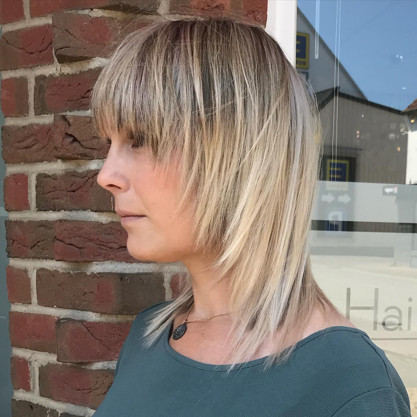 Asymmetrical Blonde Bob with Soft Fringes