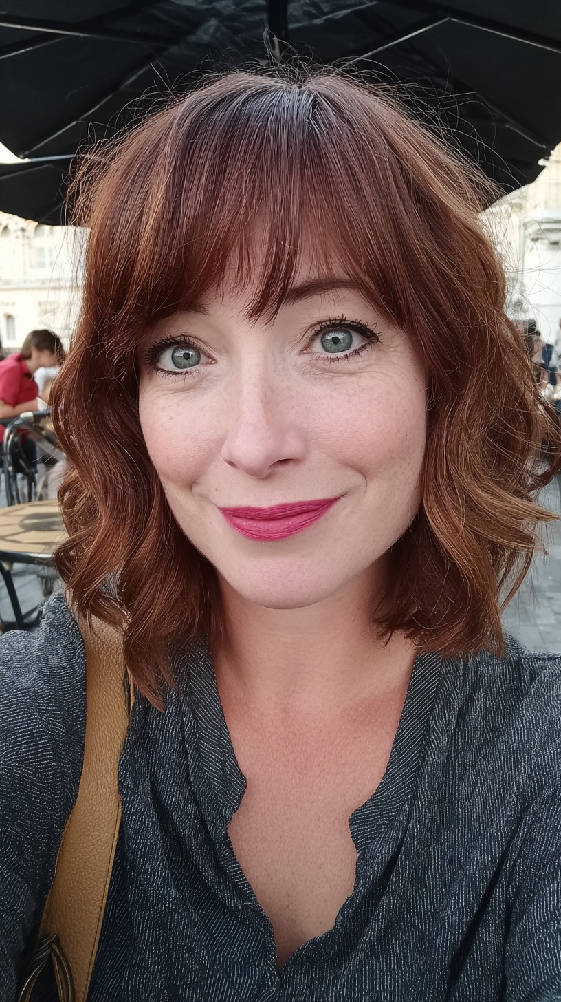 Auburn Tousled Layers with a Modern Fringe