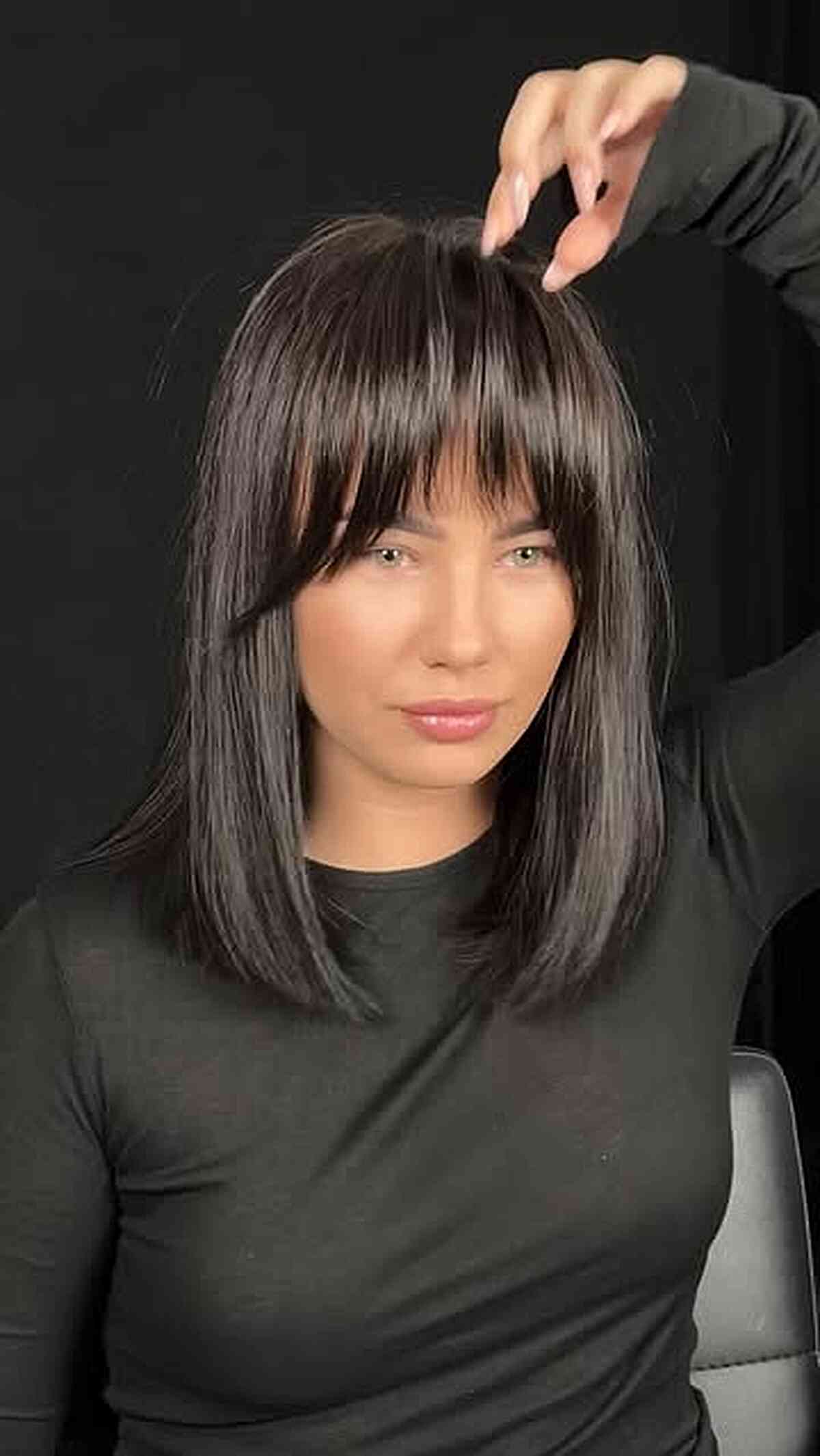 Sleek Shoulder-Length Brown Hair with Bangs