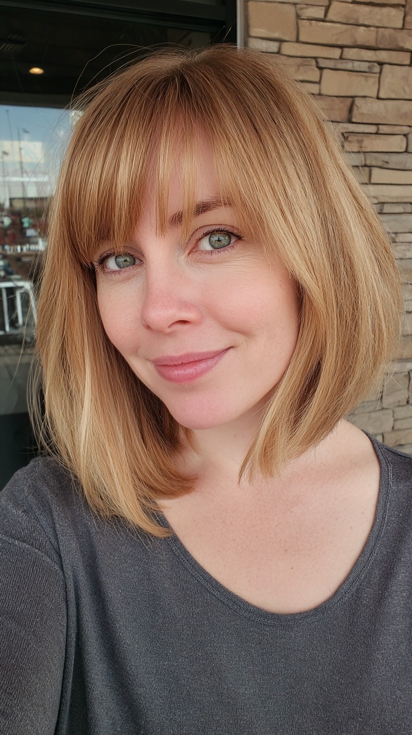 Chic Honey-Blonde Bob with Full Fringe