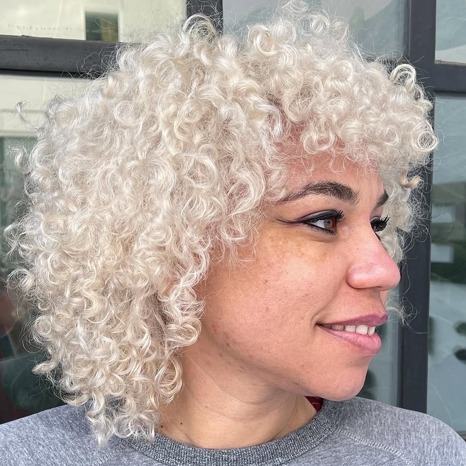 Disheveled Silver-Blonde Tight Curls with Tapered Finish