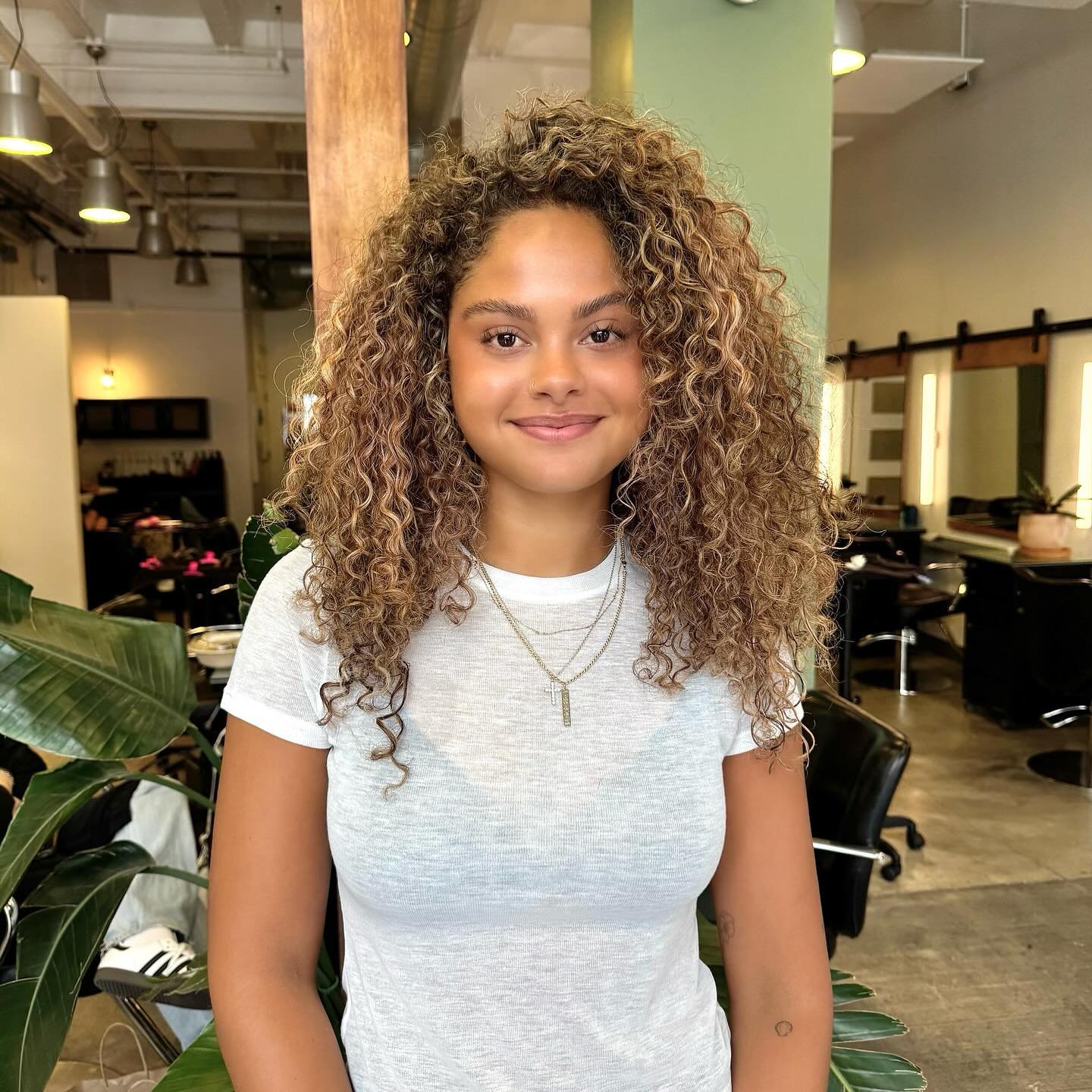 Golden Blonde Lush Spiral Curls with Subtle Layering