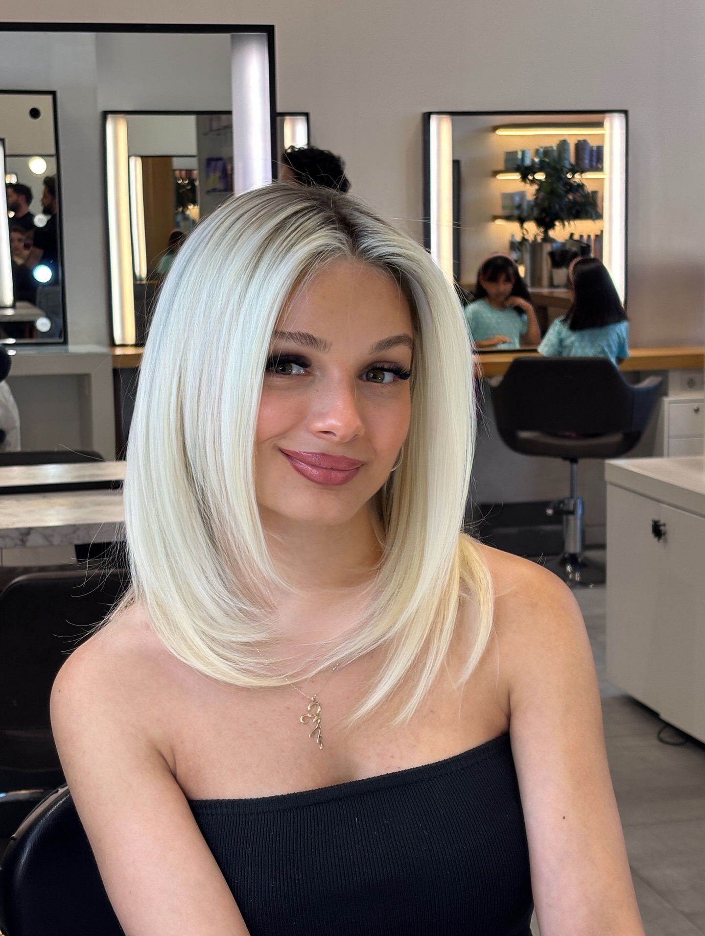 Sleek Platinum Bob with Gentle Feathered Ends