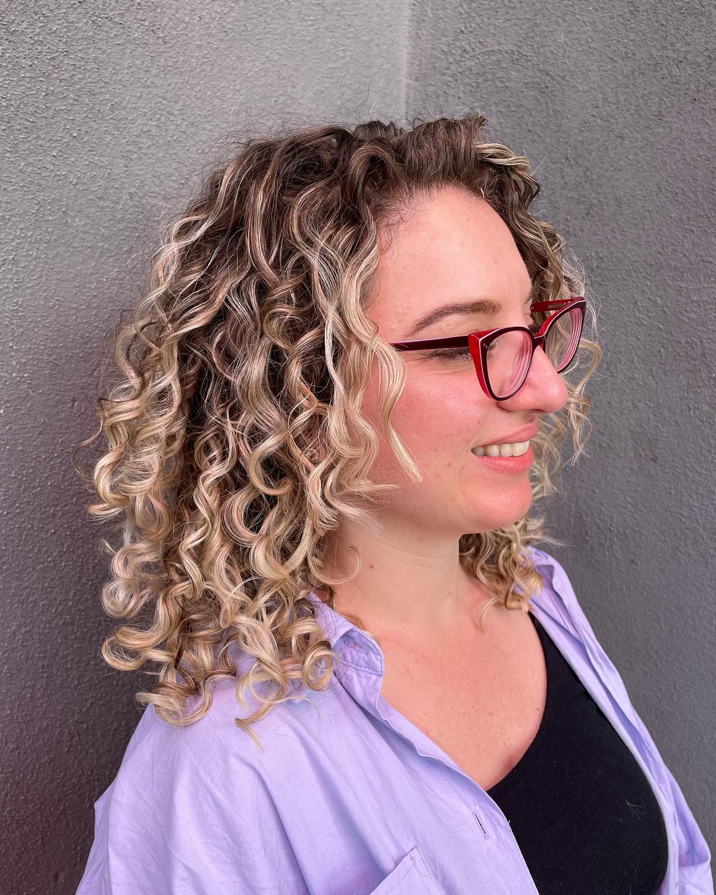 Soft Caramel Highlights on Natural Curly Locks