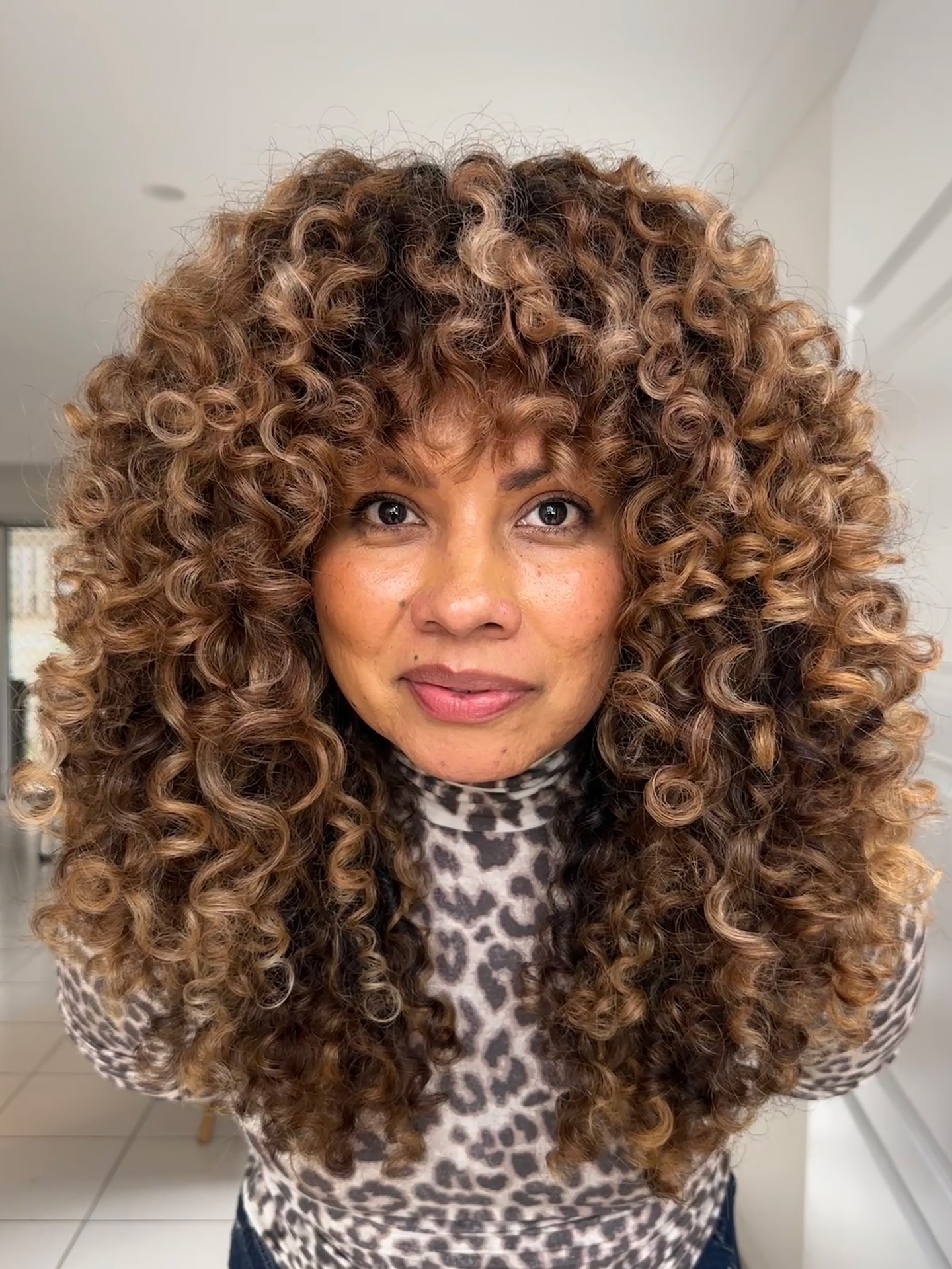 Sun-Kissed Cinnamon Spiral Curls