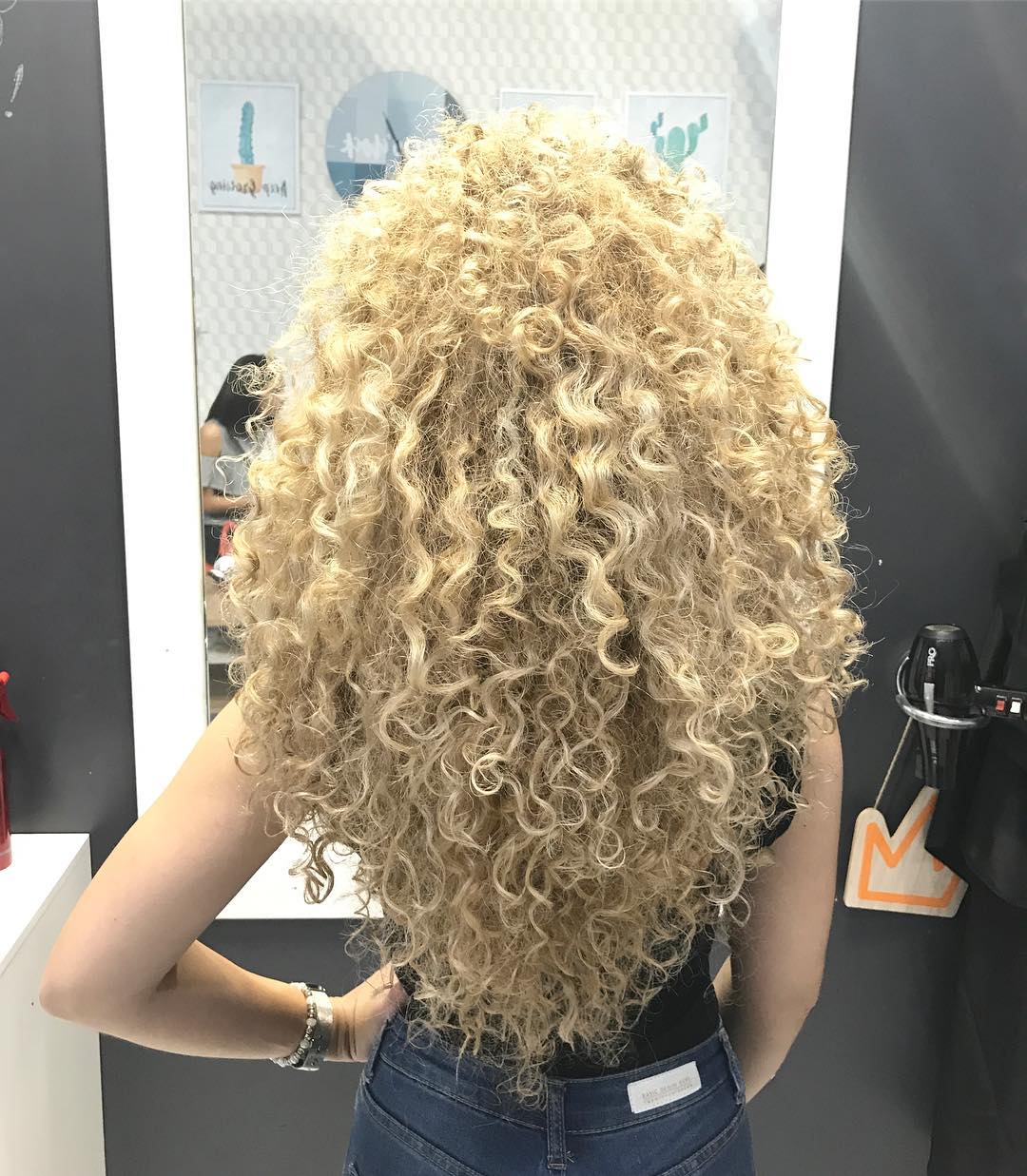 Voluminous Golden Spiral Curls with Natural Roots
