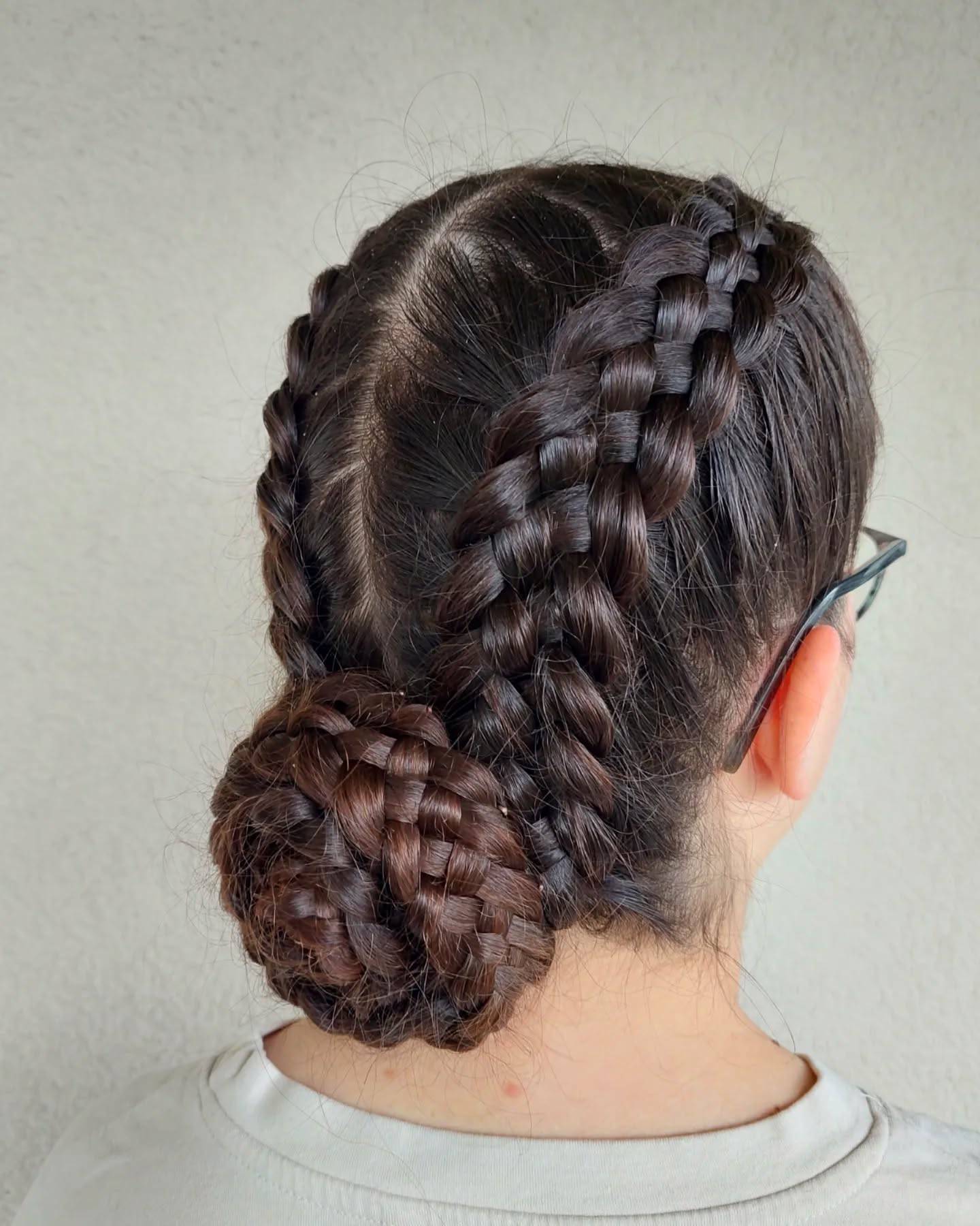 Stylish Dual Braided Bun with Intricate Detailing