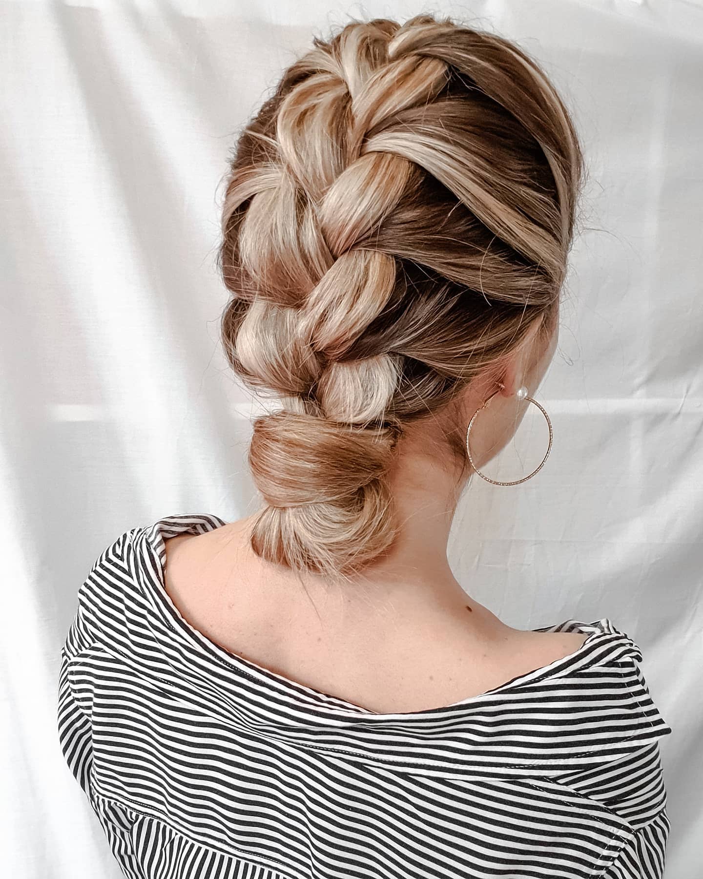 Stylish Three-Strand Braided Low Bun