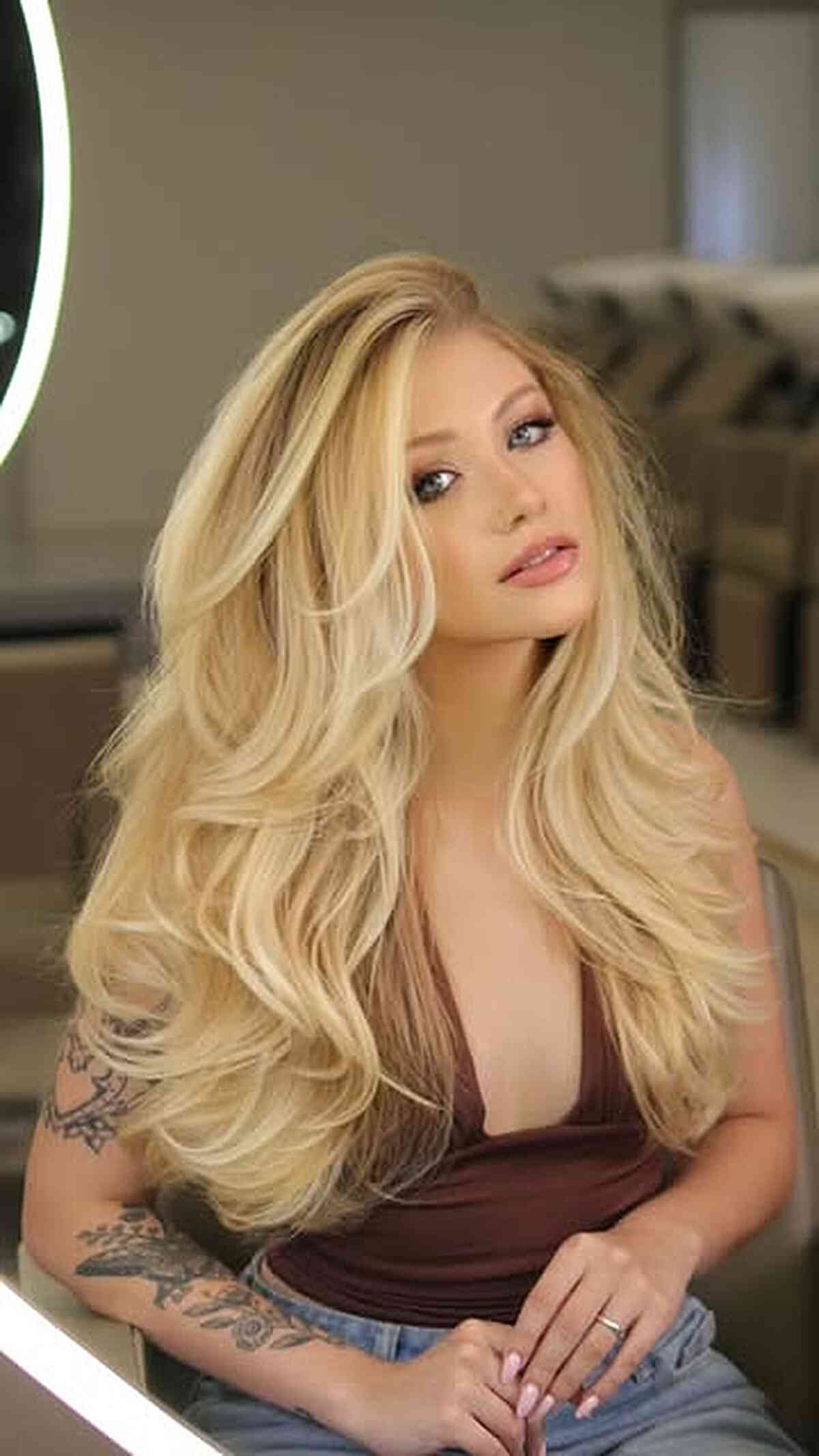 Feathered Blonde Layers with Side Part