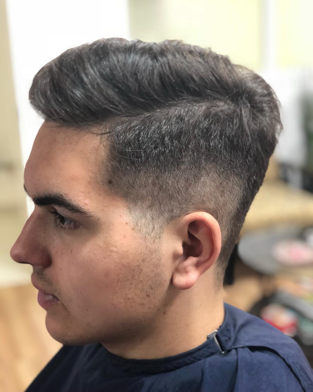 Sleek High-Volume Pompadour with Tapered Fade