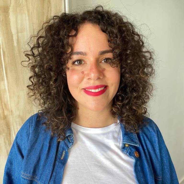 Effortlessly Playful Curly Face-Framing Cut