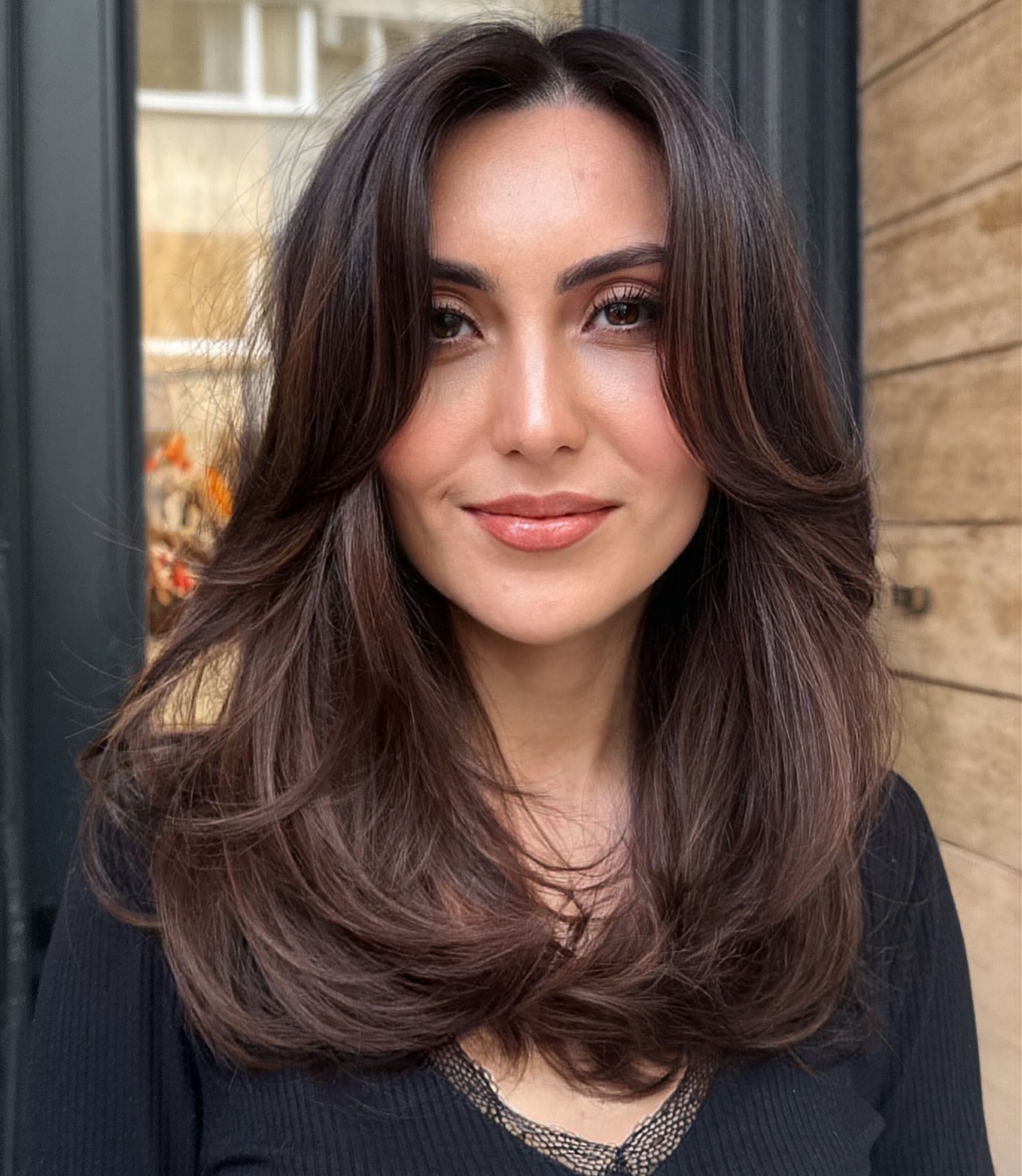 Elegant Layered Haircut with Face-Framing Bangs