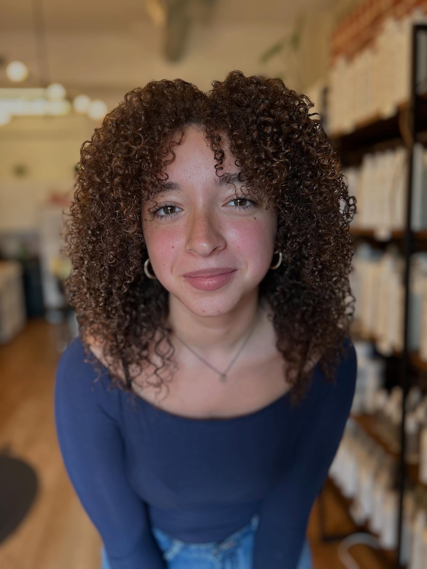 Radiant Curly Face-Framing Cut with Defined Layers