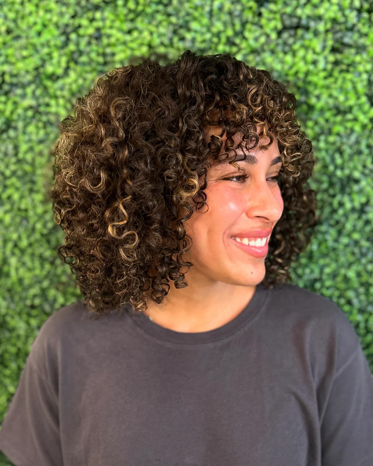 Textured Curly Face-Framing Cut with Soft Highlights