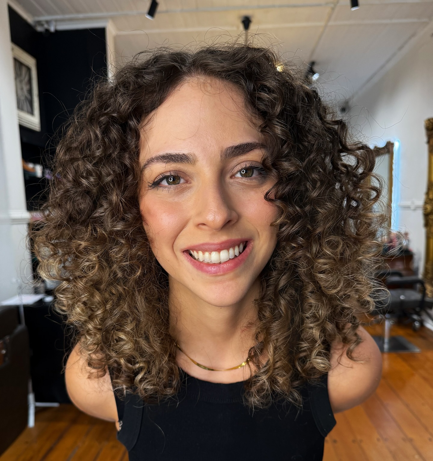 Textured Curly Layers with Subtle Highlights