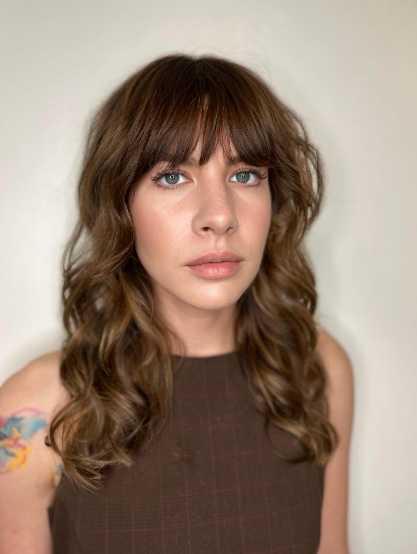 Textured Medium-Length Hair with Soft Bangs