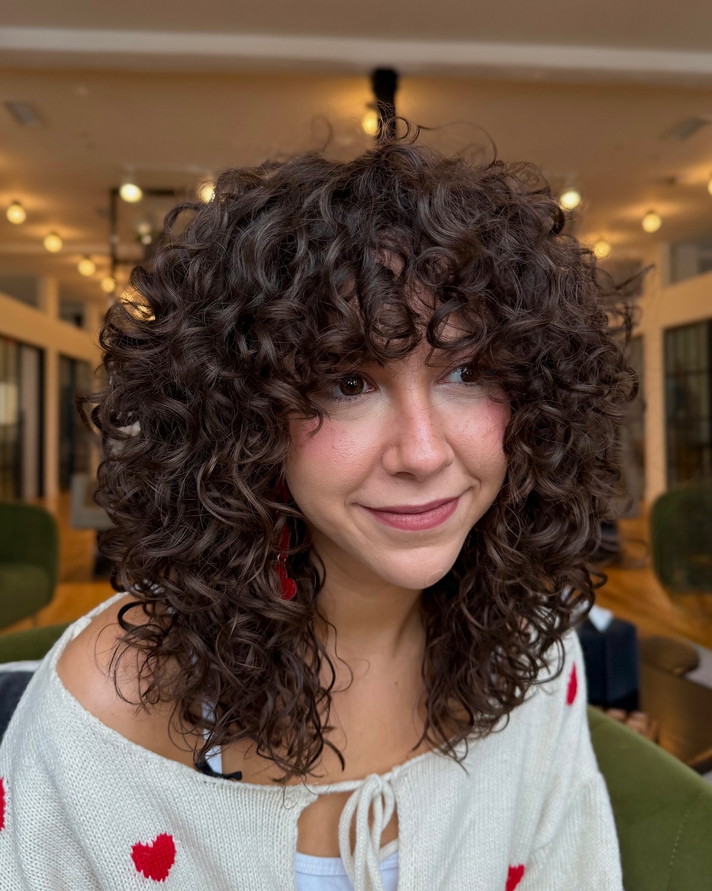 Voluminous Curly Face-Framing Layers