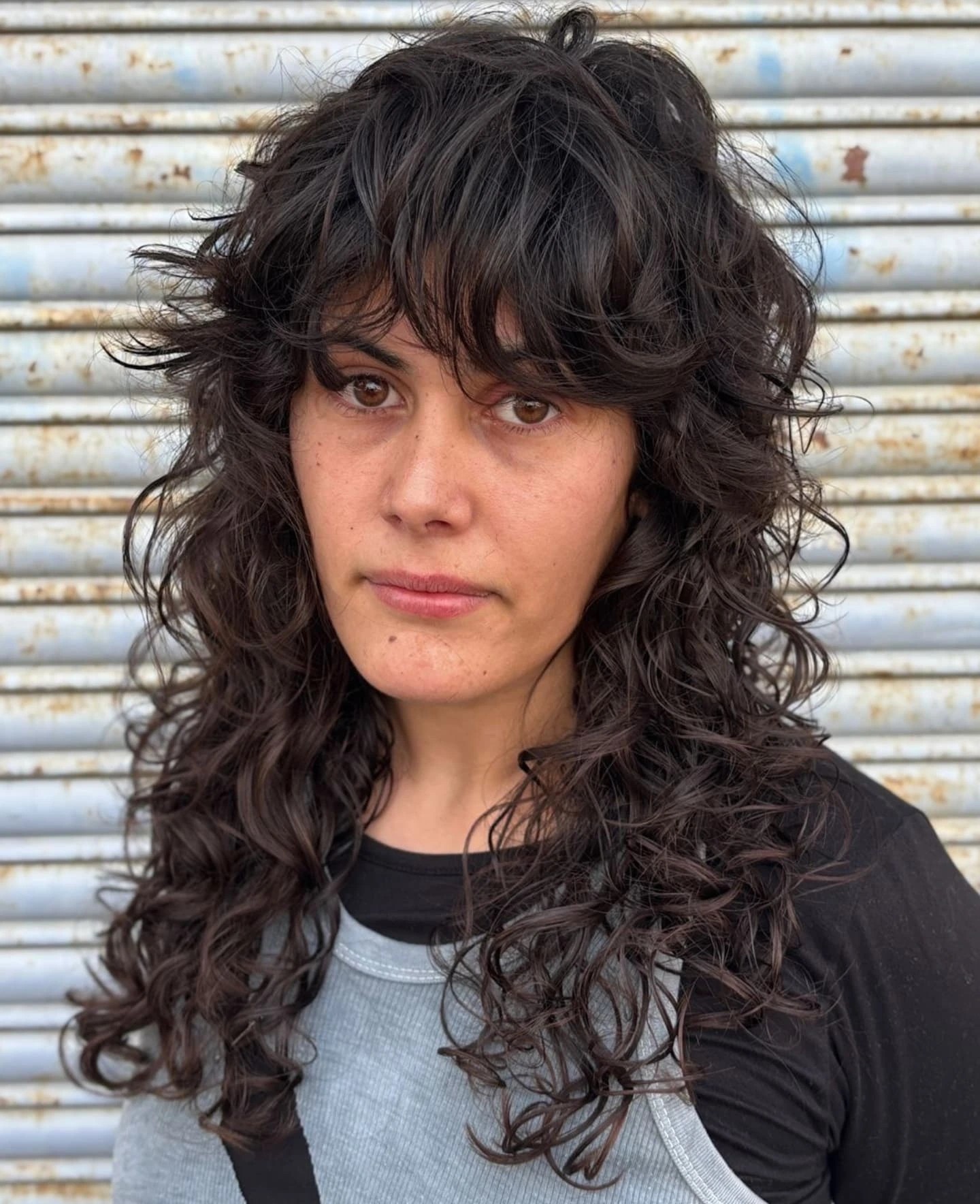 Brunette Spiraled Curls with Wispy Bangs