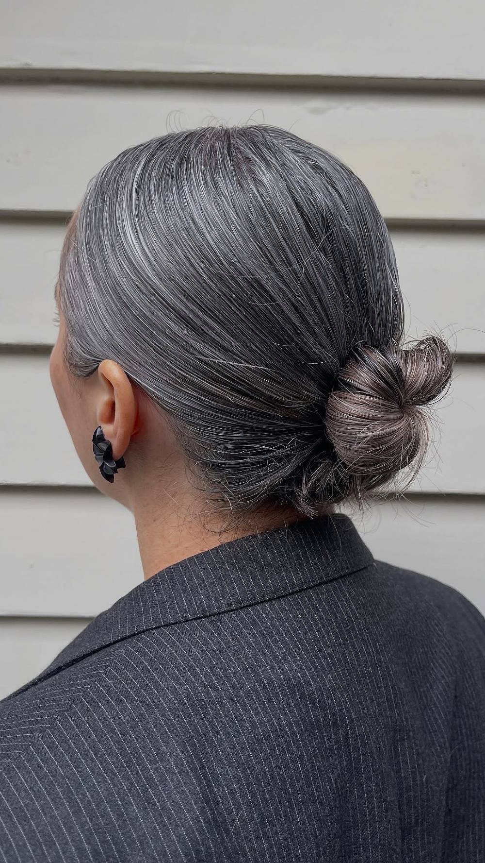 Chic Silver Low Bun with Subtle Highlights