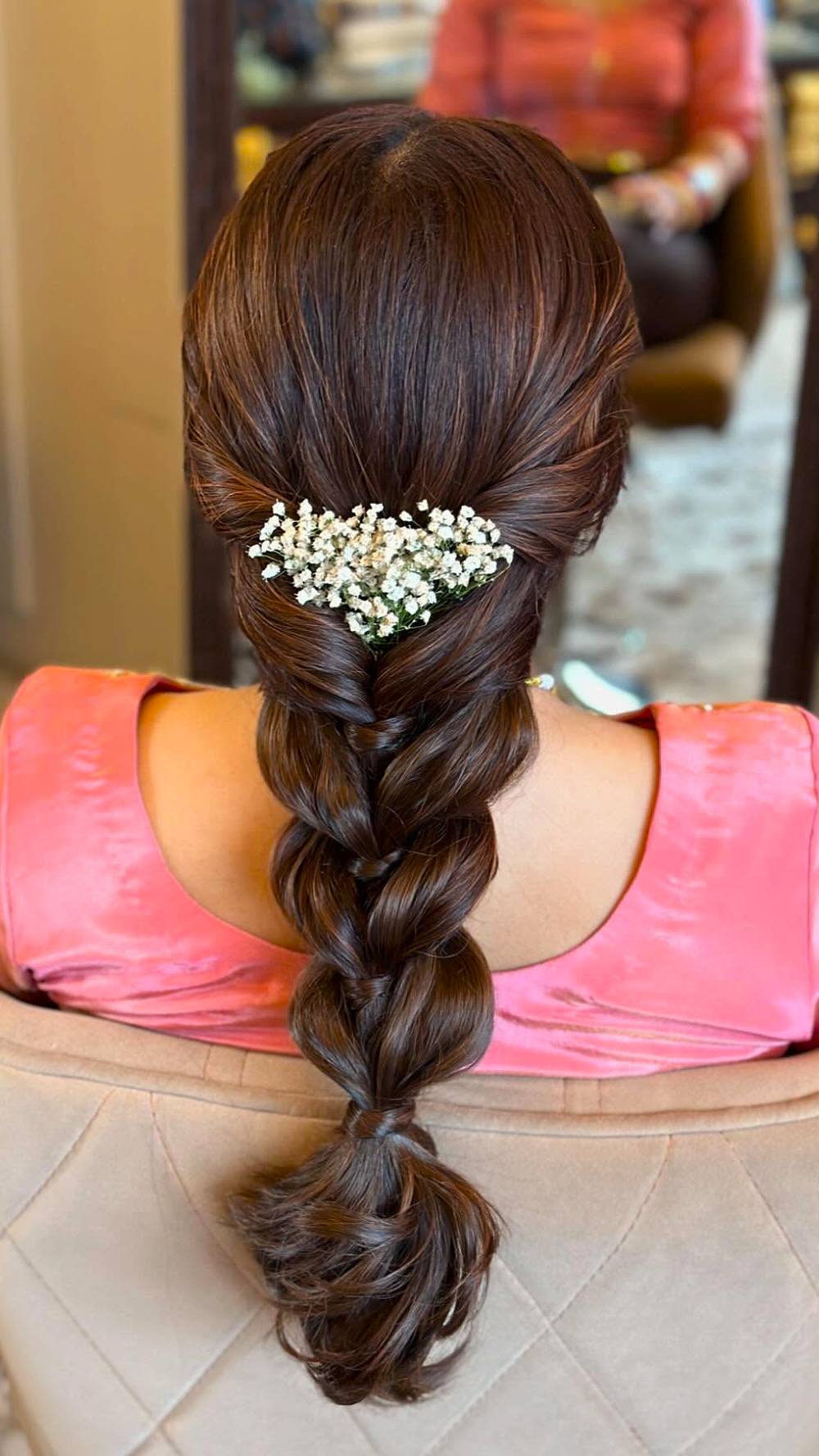 Elegant Classic Braided Hairstyle with Floral Accent