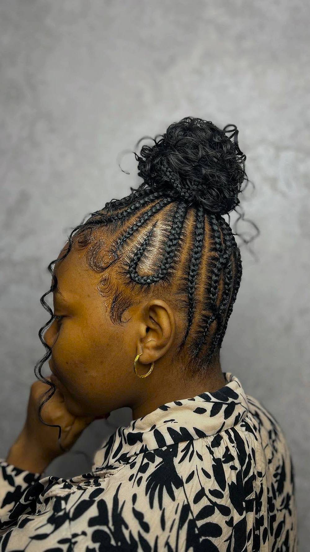 Elegant High Bun with Intricate Cornrow Braids