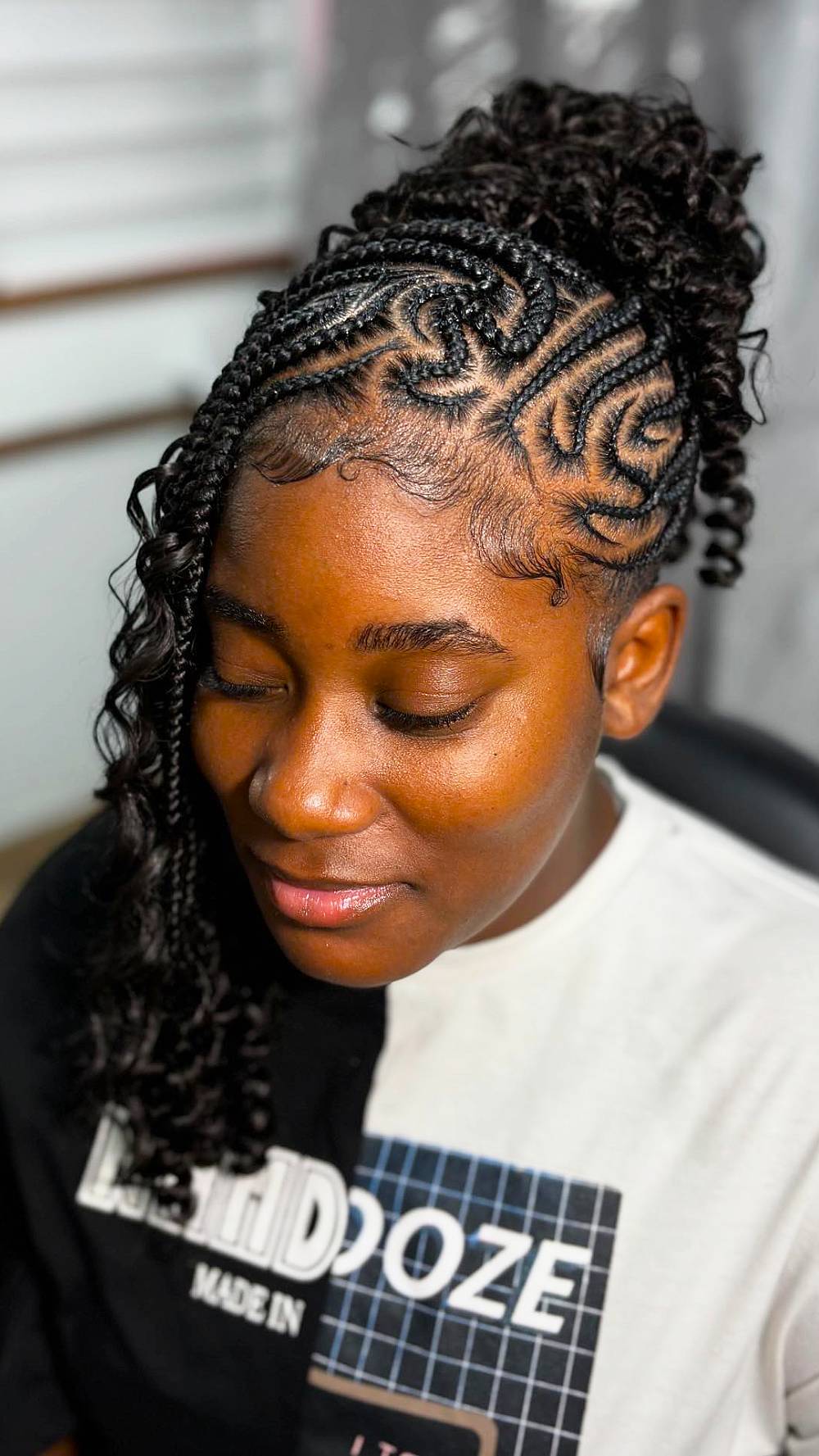 Stylish Half-Up Cornrow Braids with Defined Curls