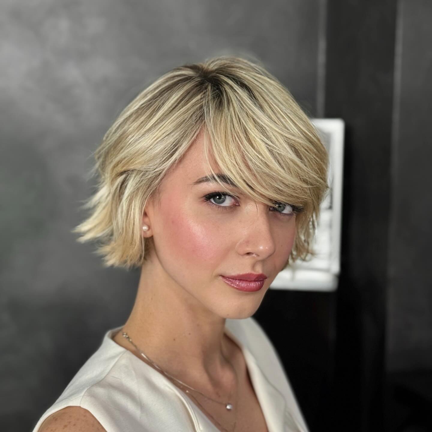 Textured Blonde Bob with Side-Swept Bangs