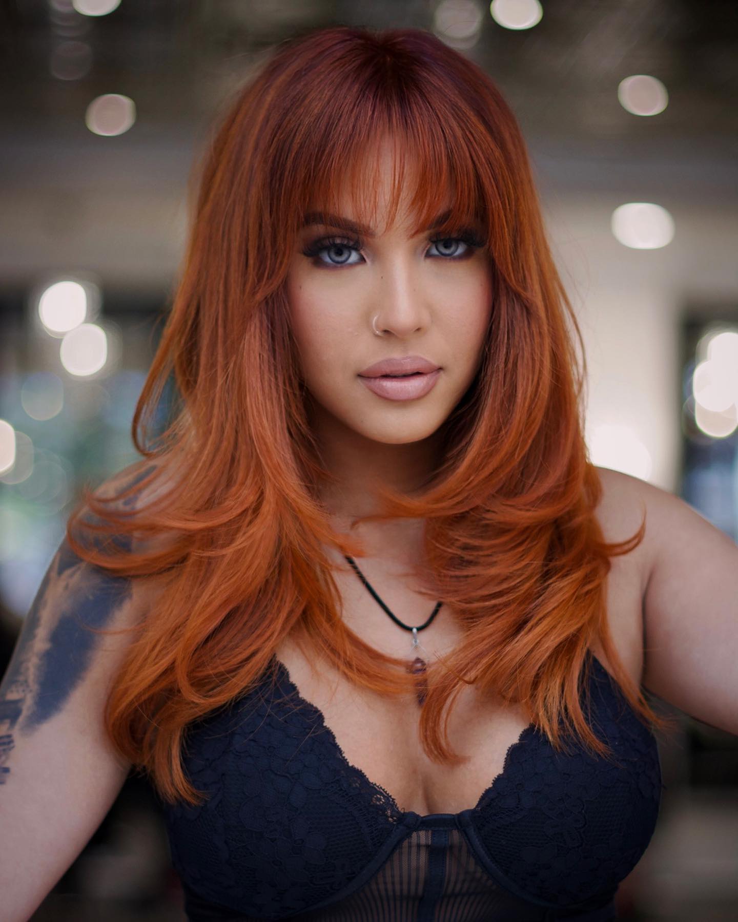 Vibrant Pumpkin Spice Layered Bob With Wispy Bangs