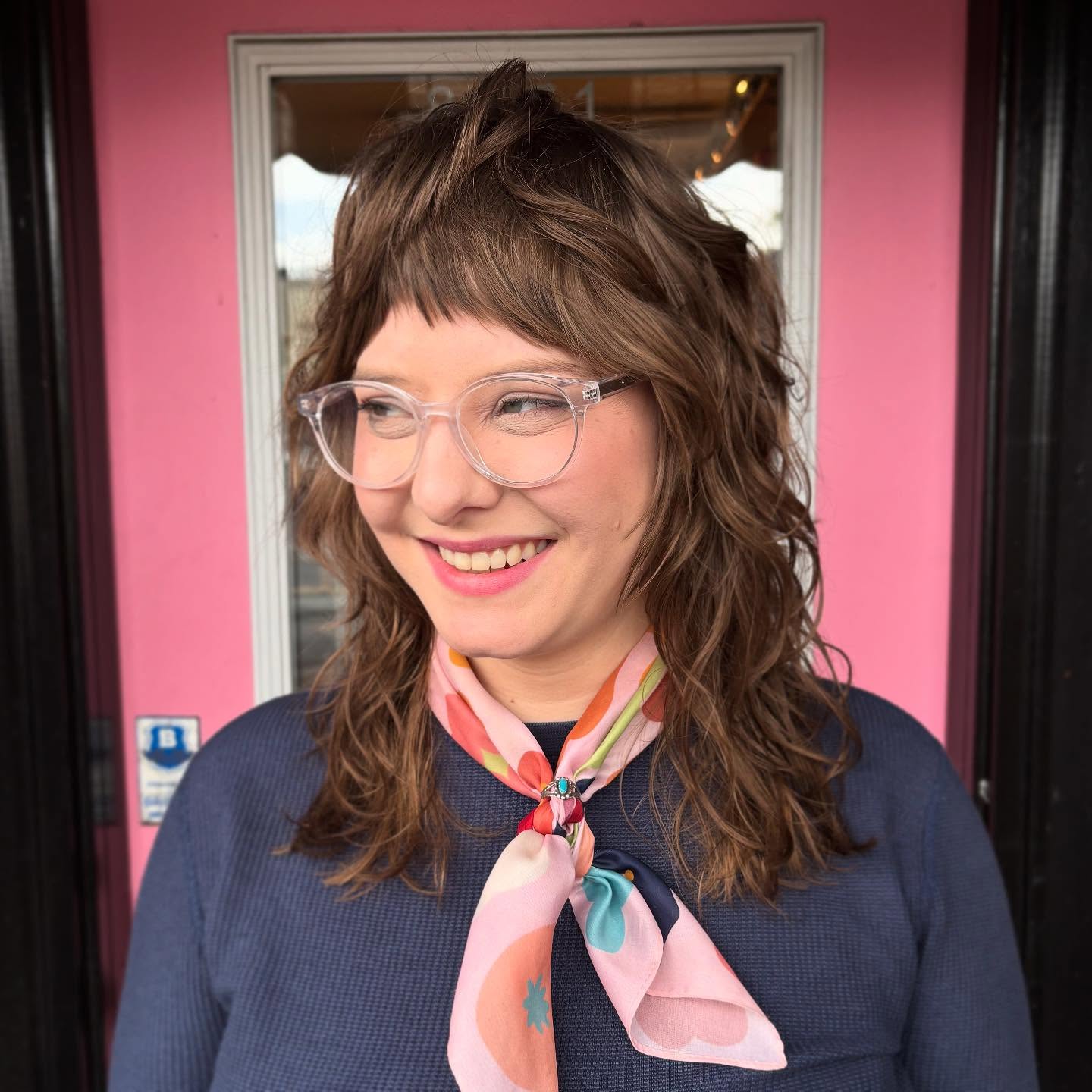 Whimsical Wavy Shoulder-Length Bob with Choppy Bangs