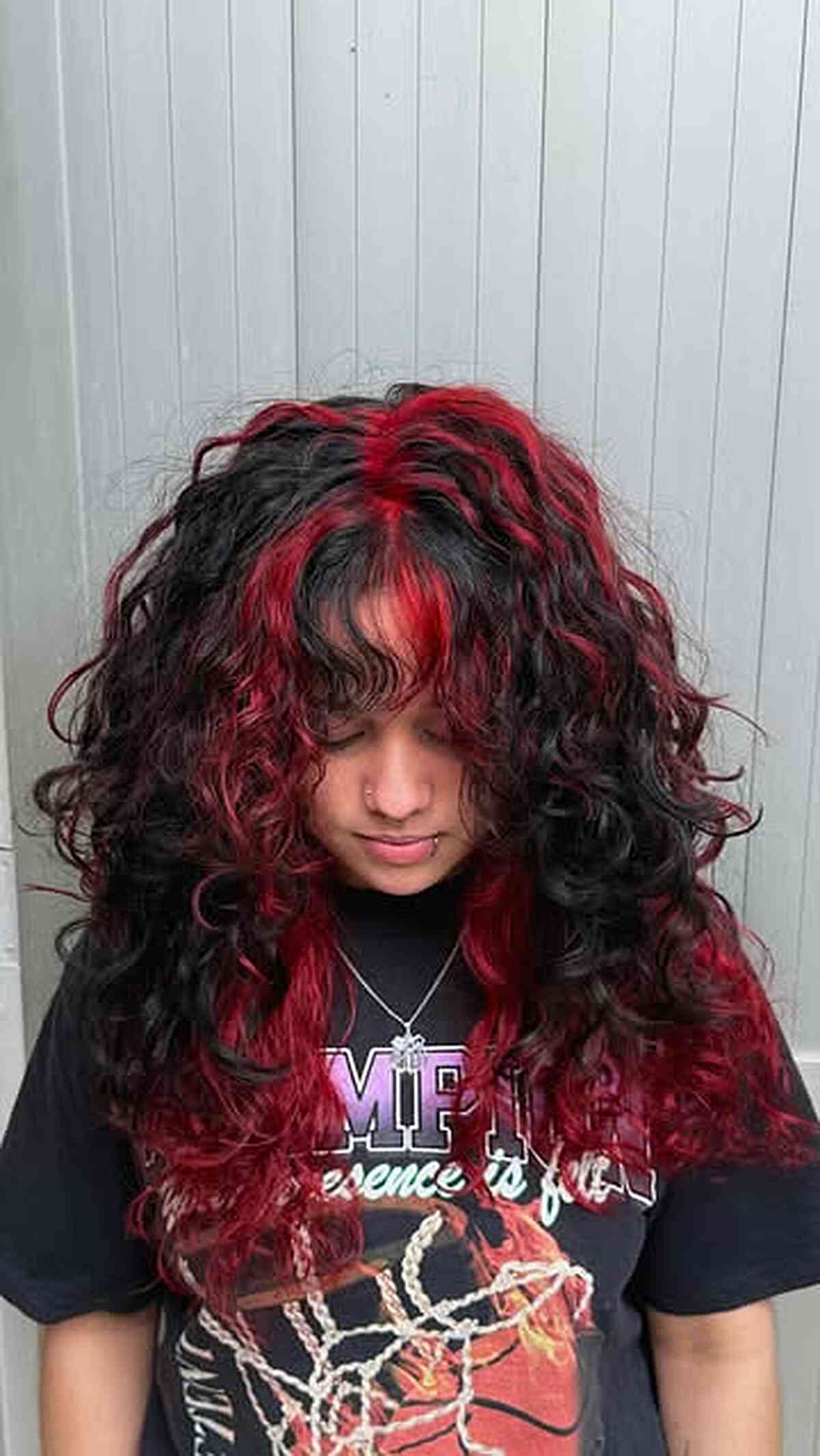Bold Long Curly Hair with Red Highlights