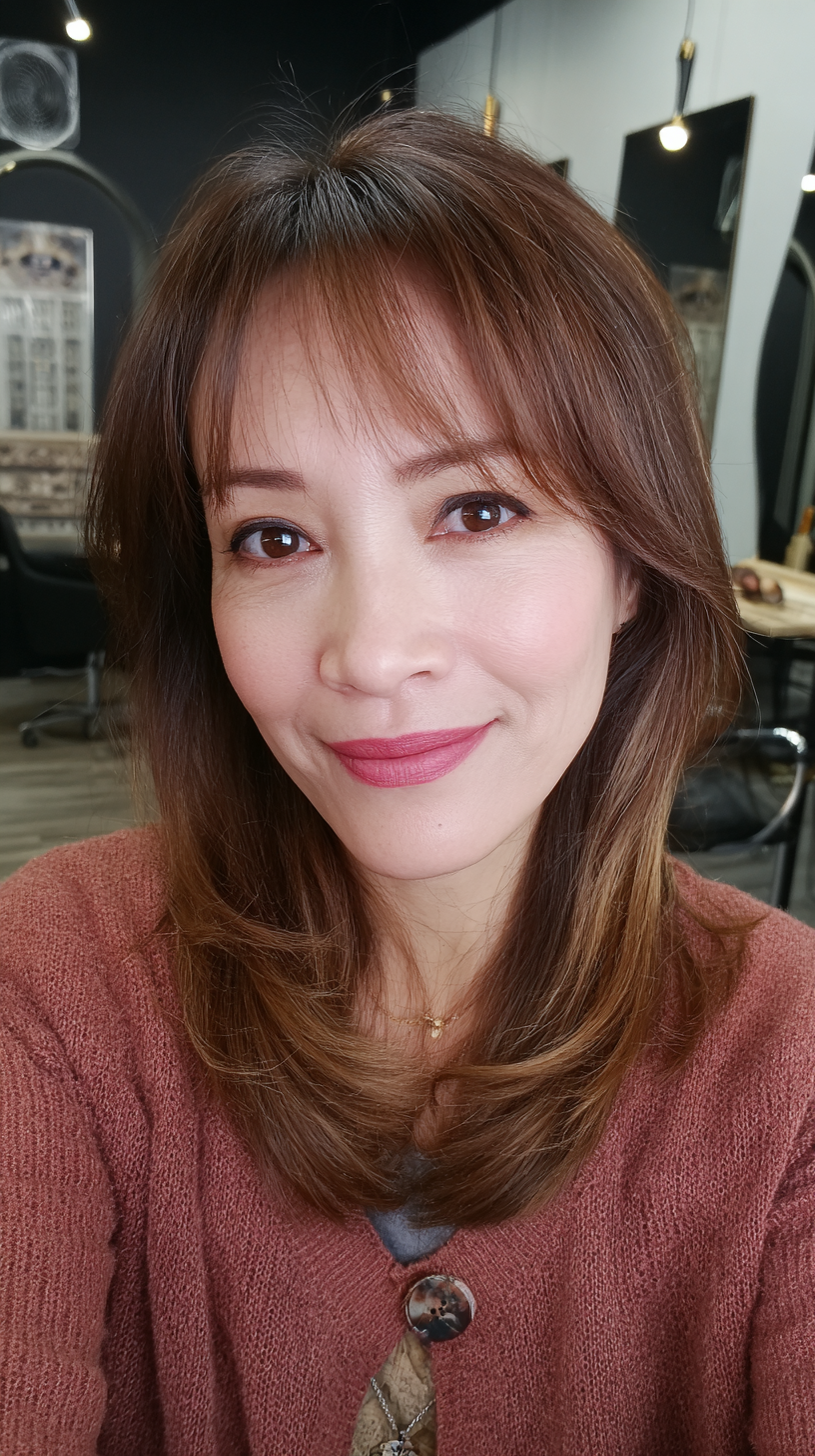 Chic Medium-Length Cut with Soft Face-Framing Bangs