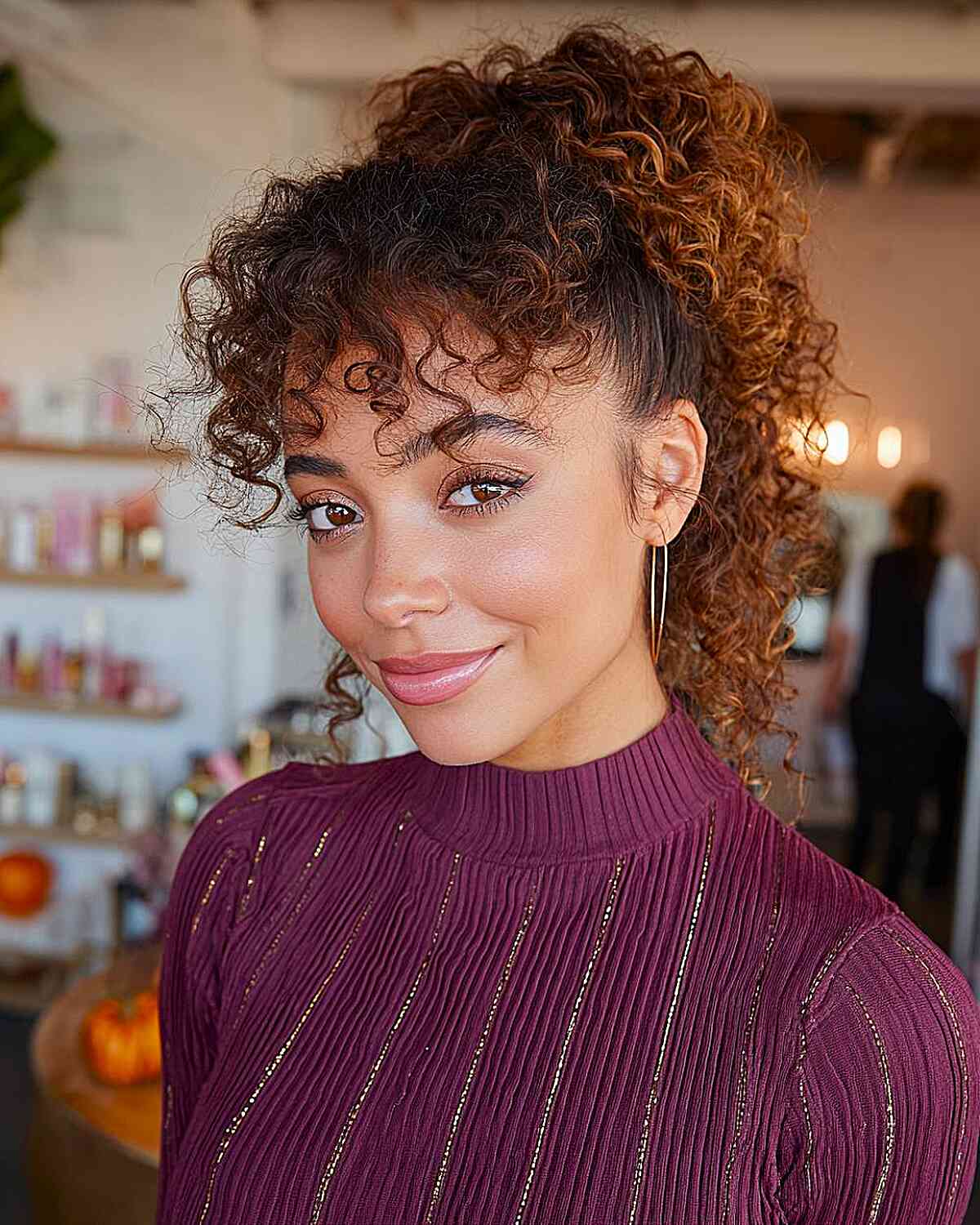 Curly High Ponytail with Face-Framing Layers