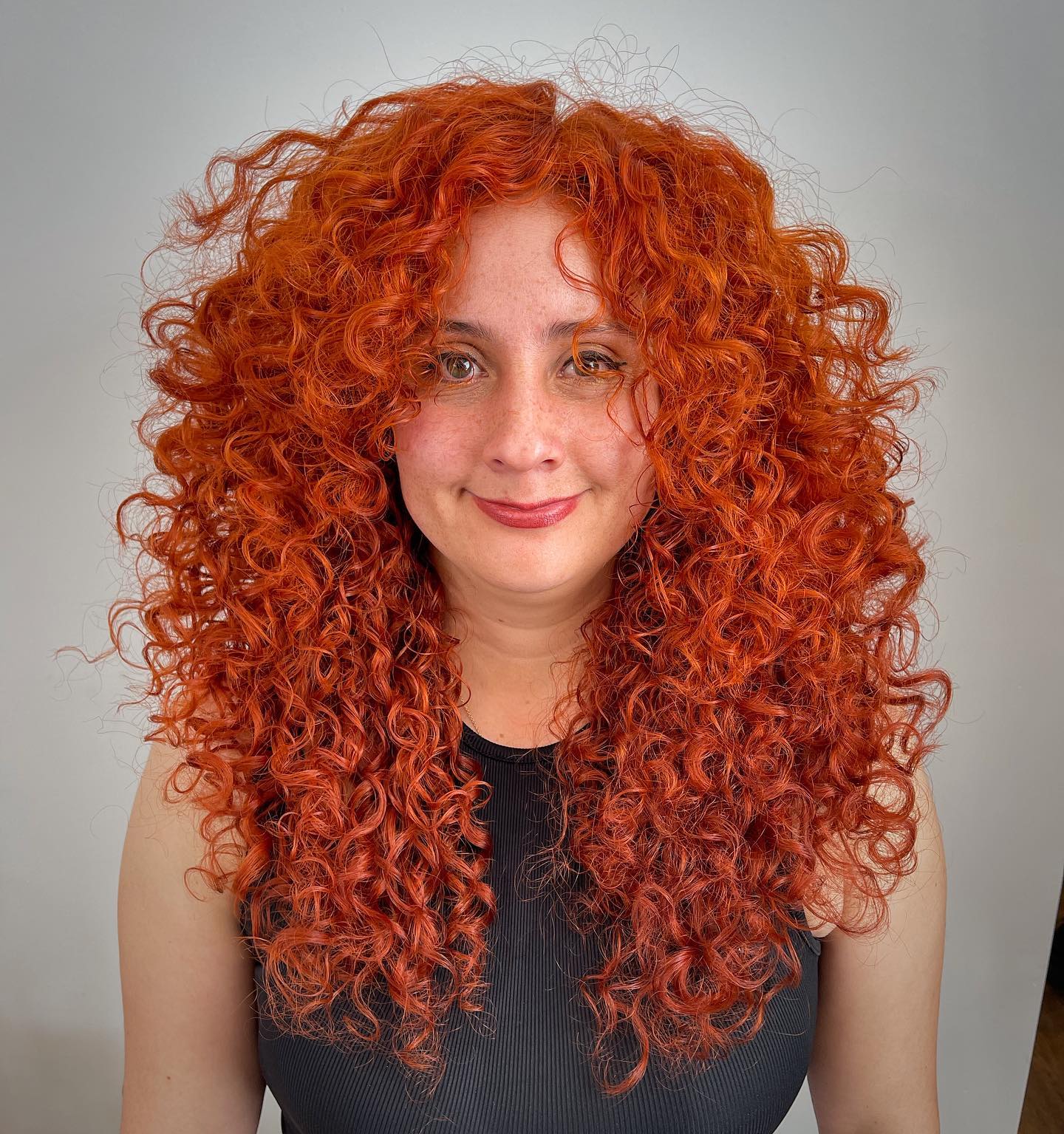 Fiery Red Cascading Curls with Voluminous Texture