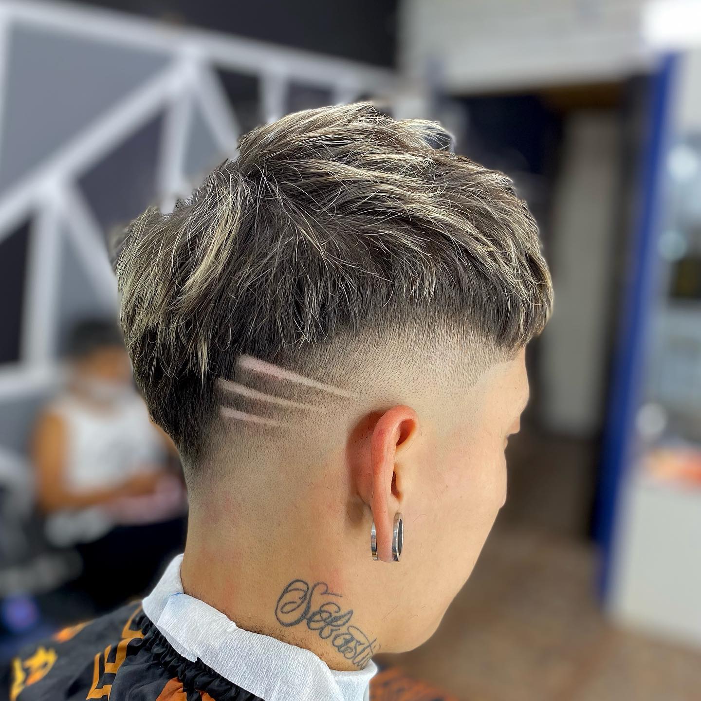 Artistic Faded Mohawk with Creative Side Etching